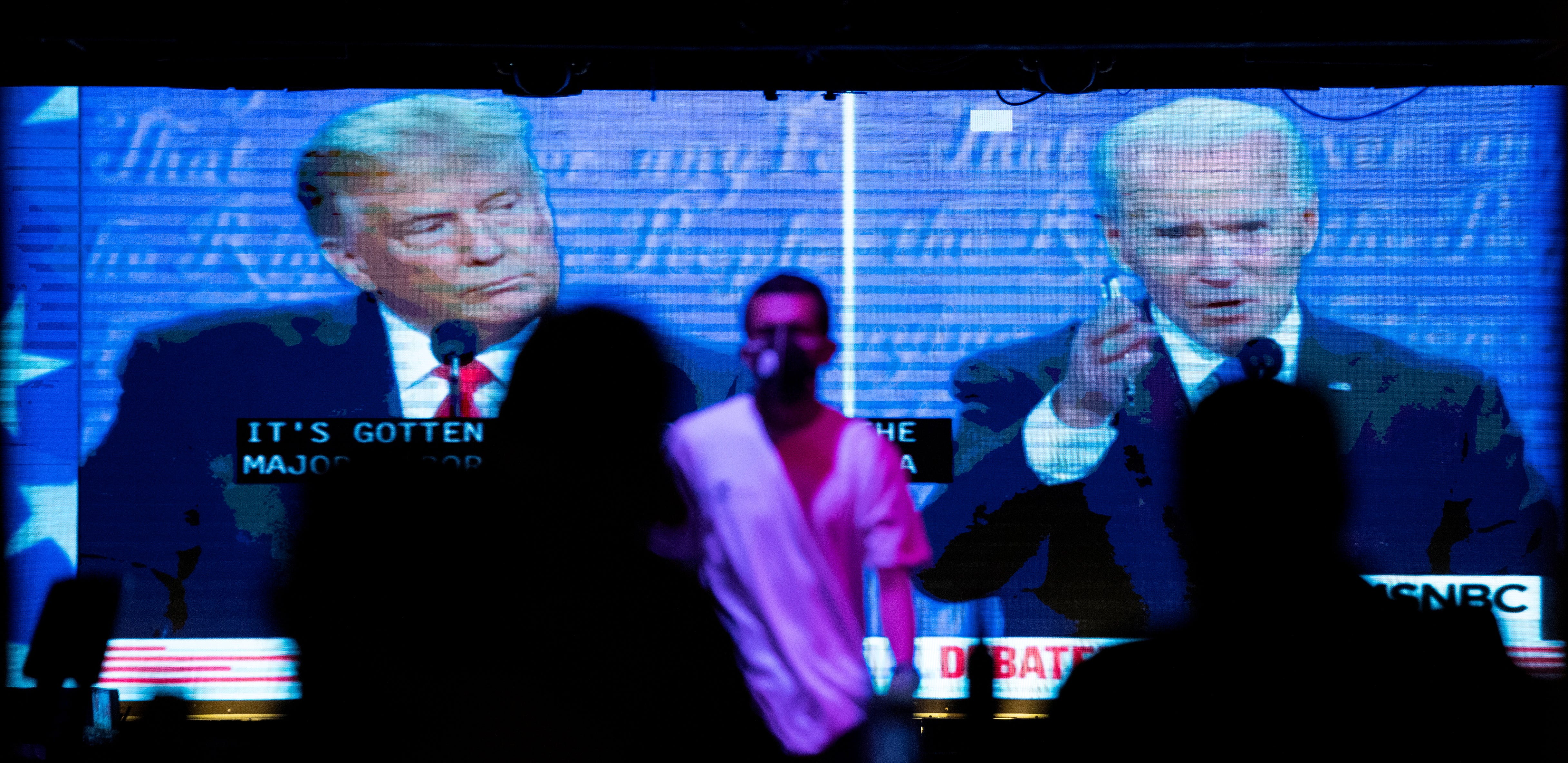 People watch the second 2020 presidential campaign debate between Democratic presidential nominee Joe Biden and U.S. President Donald Trump at The Abbey Bar in West Hollywood, California on October 22, 2020.