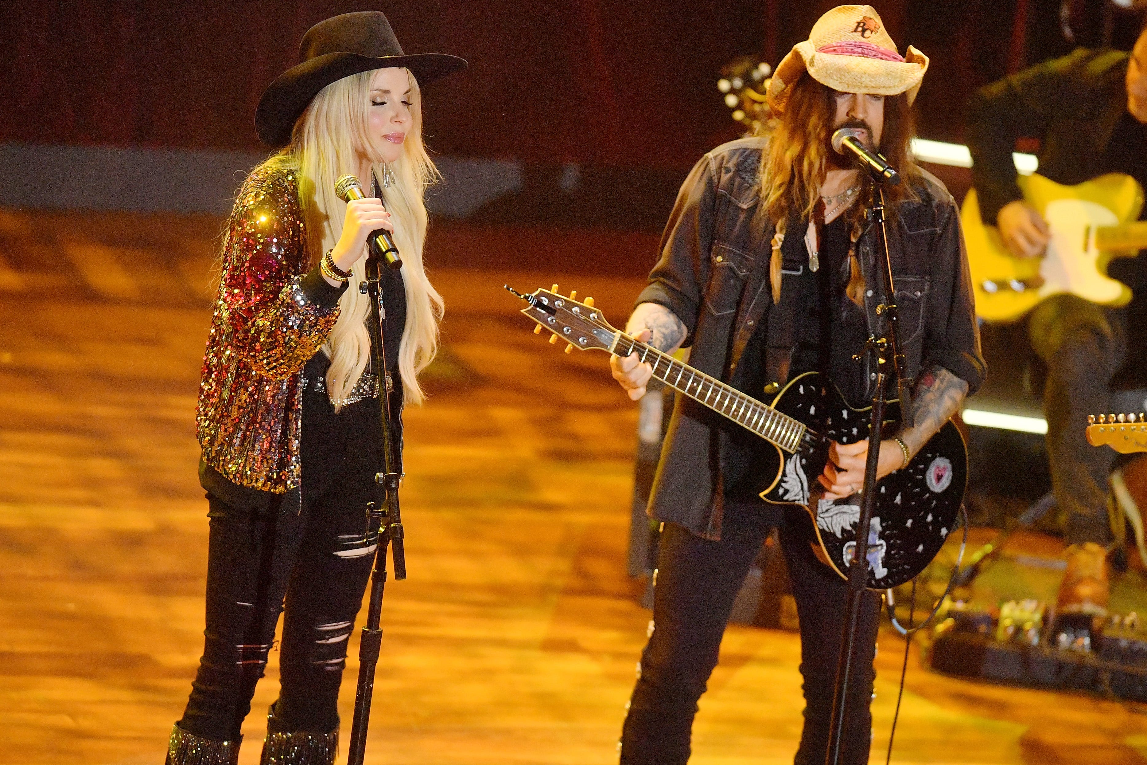 Firerose (left) and Billy Ray Cyrus perform onstage during the 16th Annual Academy of Country Music Honors at Ryman Auditorium on Aug. 23, 2023, in Nashville.
