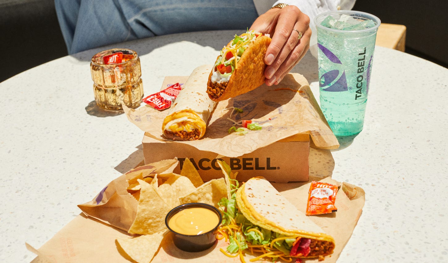 Taco Bell's new $7 limited-time Luxe Cravings Box comes with a Chalupa Supreme, Beefy 5-Layer Burrito, Double Stacked Taco, chips and nacho cheese sauce, and a medium drink.