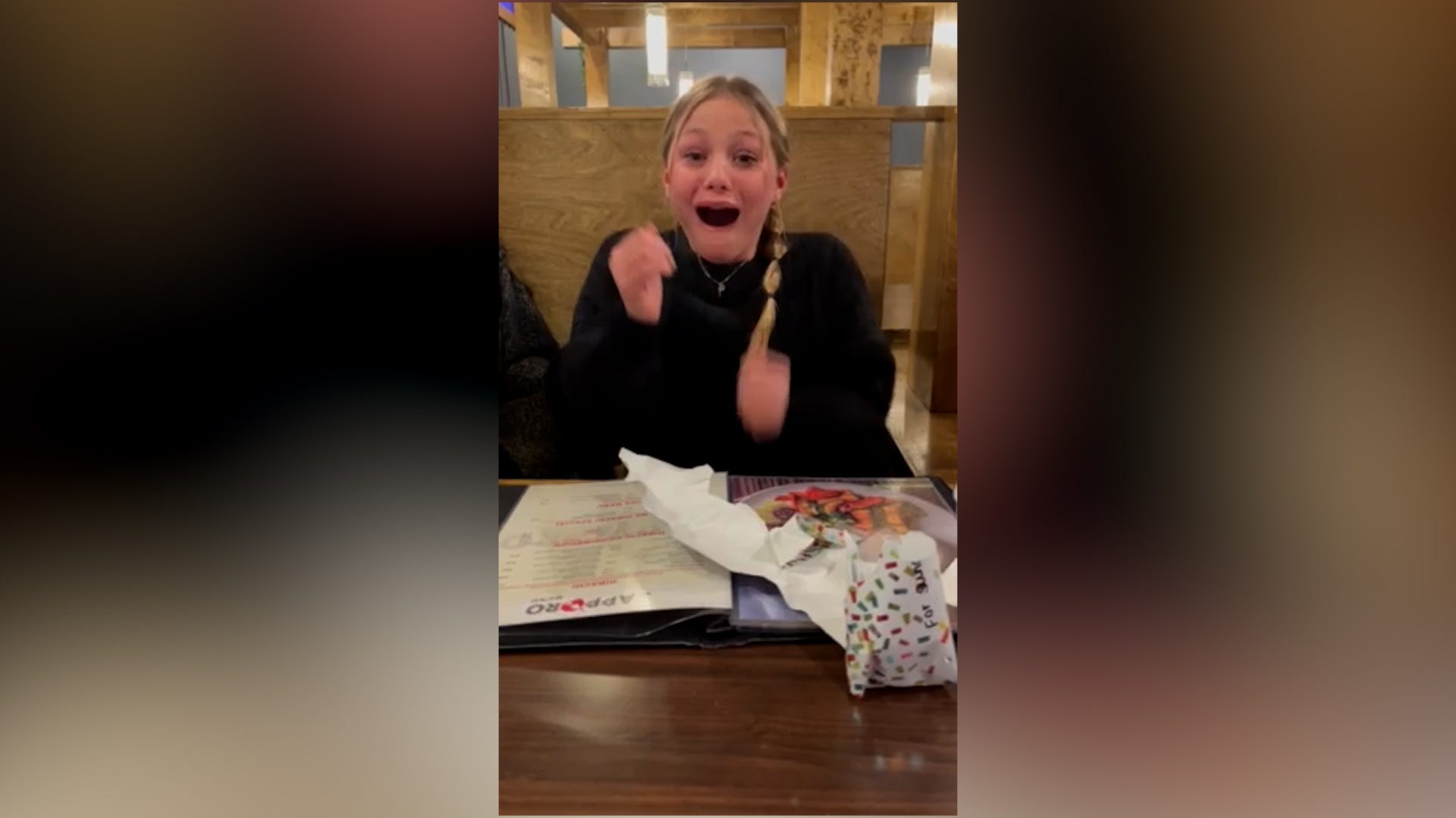 Girl surprised by her parents' pregnancy news