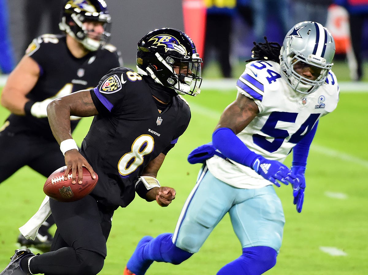 The Baltimore Ravens, led by QB Lamar Jackson (8), and Dallas Cowboys are among the NFL teams looking to retain their divisional crowns in 2024.