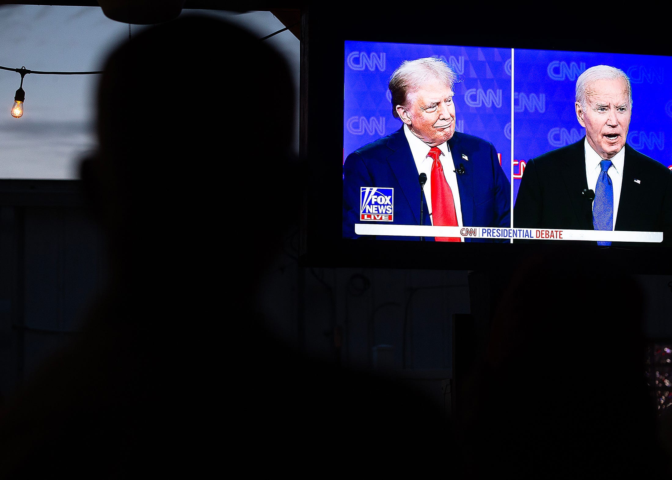 People watch the presidential debate at the Fleet Reserve Association in Panama City Beach, Fla., June 27, 2024. (The second debate is scheduled for Sept. 10. (Tyler Orsburn/News Herald)