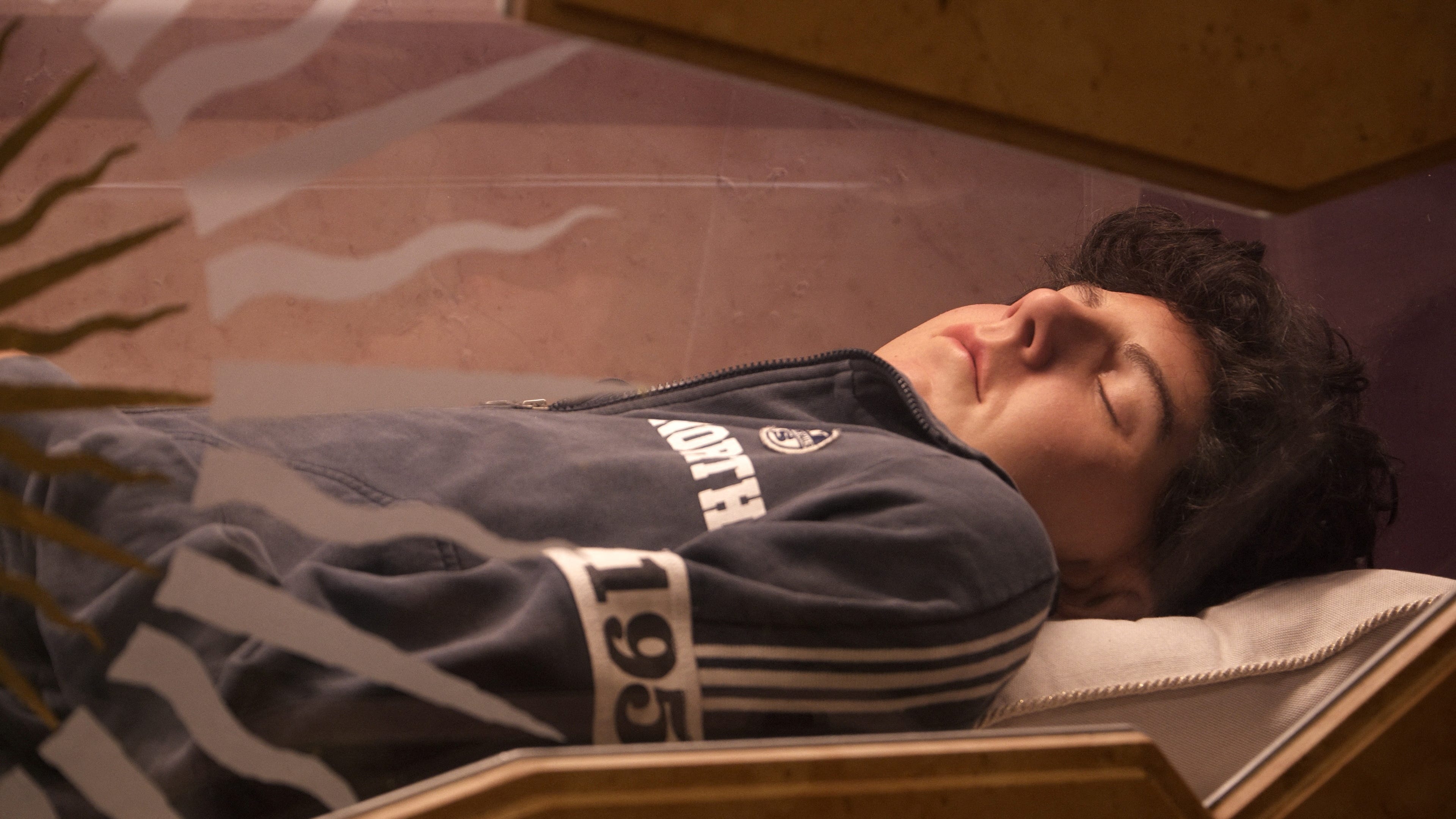 Body of Carlo Acutis, who died of leukemia in 2006 aged 15, is seen inside his tomb in the Church of Santa Maria Maggiore in Assisi, Italy, May 26, 2024. Pope Francis has cleared the way for Acutis to be the first saint of the millennial generation. REUTERS/Matteo Berlenga