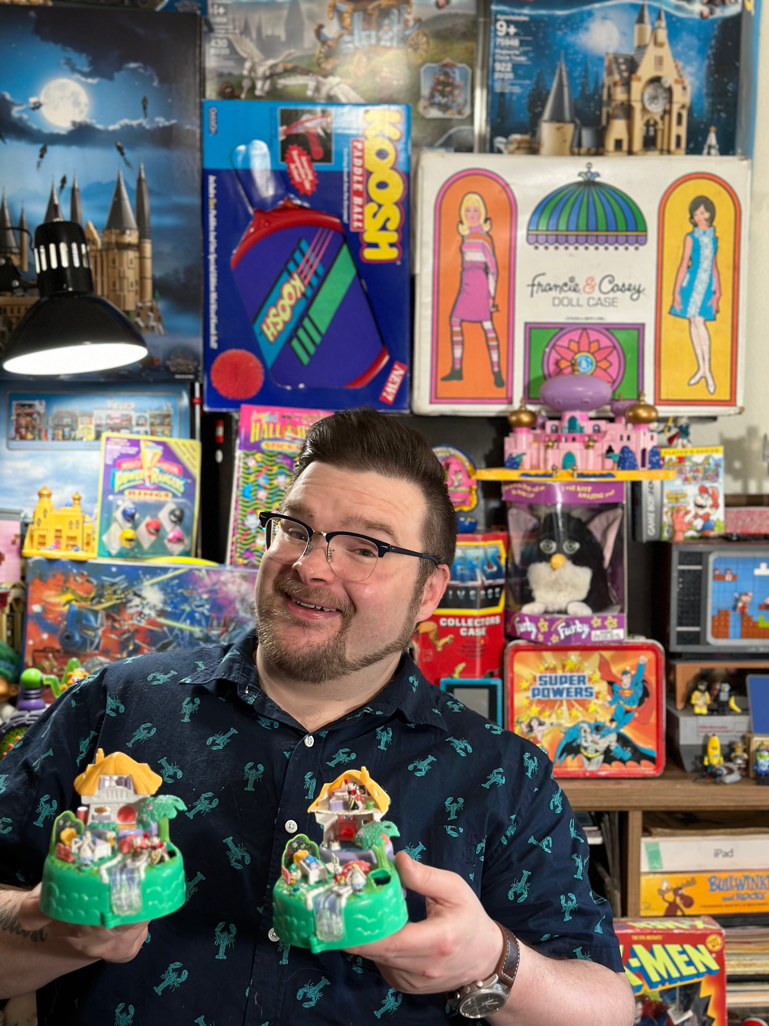 Tom Schaller of Portland, Oregon sells vintage toys on eBay. Schaller said consumers feeding on nostalgia are a big reason his business does well. He's holding a Polly Pocket Disney 1996 Alice in Wonderland Glitter Variation set, which sells for $549.
