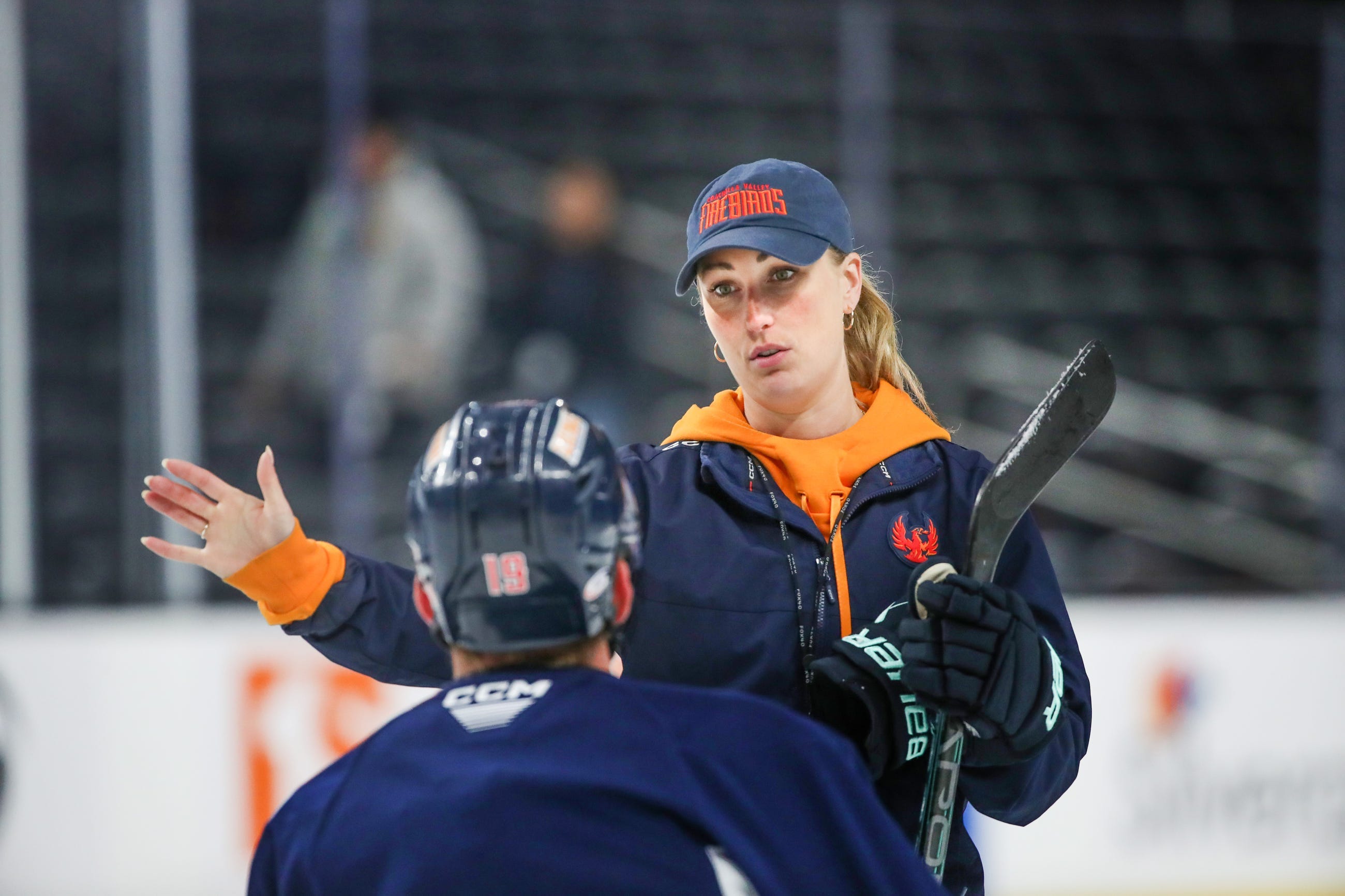 Coachella Valley Firebirds assistant coach Jessica Campbell talks to Firebirds forward Cameron Hughes (19) during practice in May.