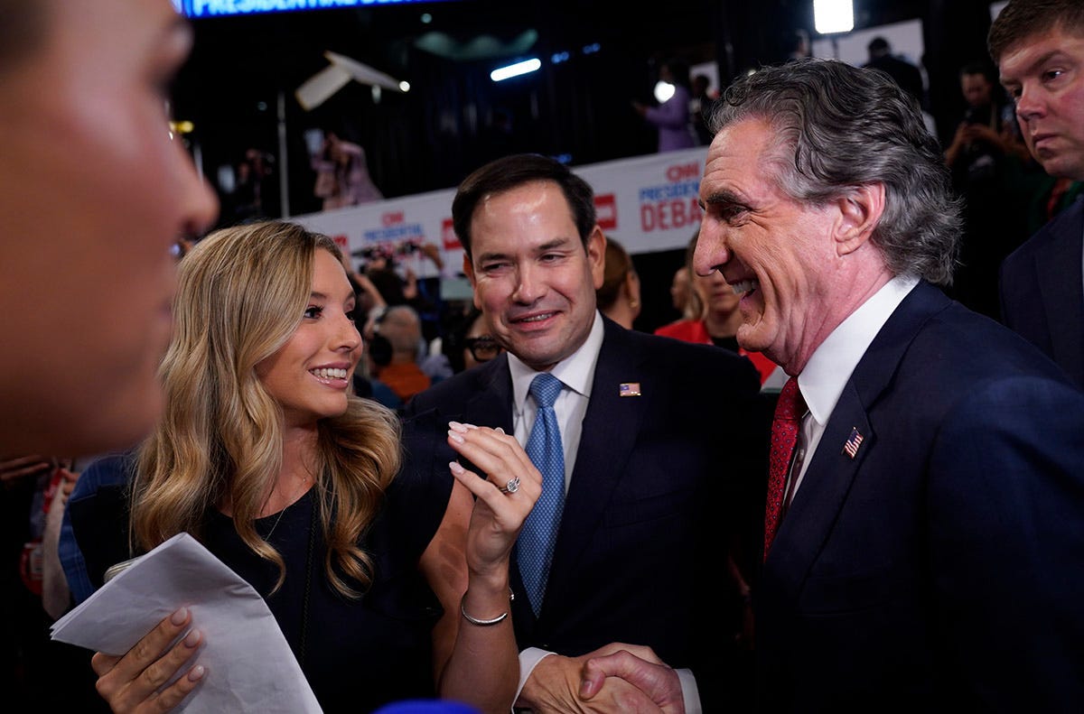 North Dakota Gov. Doug Burgum, right, runs into Senator Marco Rubio (R-FL) while making media rounds in the Spin Room at Georgia Tech's McCamish Pavilion after the CNN Presidential Debate between President Joe Biden and former President Donald Trump held at CNN's studios in Atlanta on Jun 27, 2024.