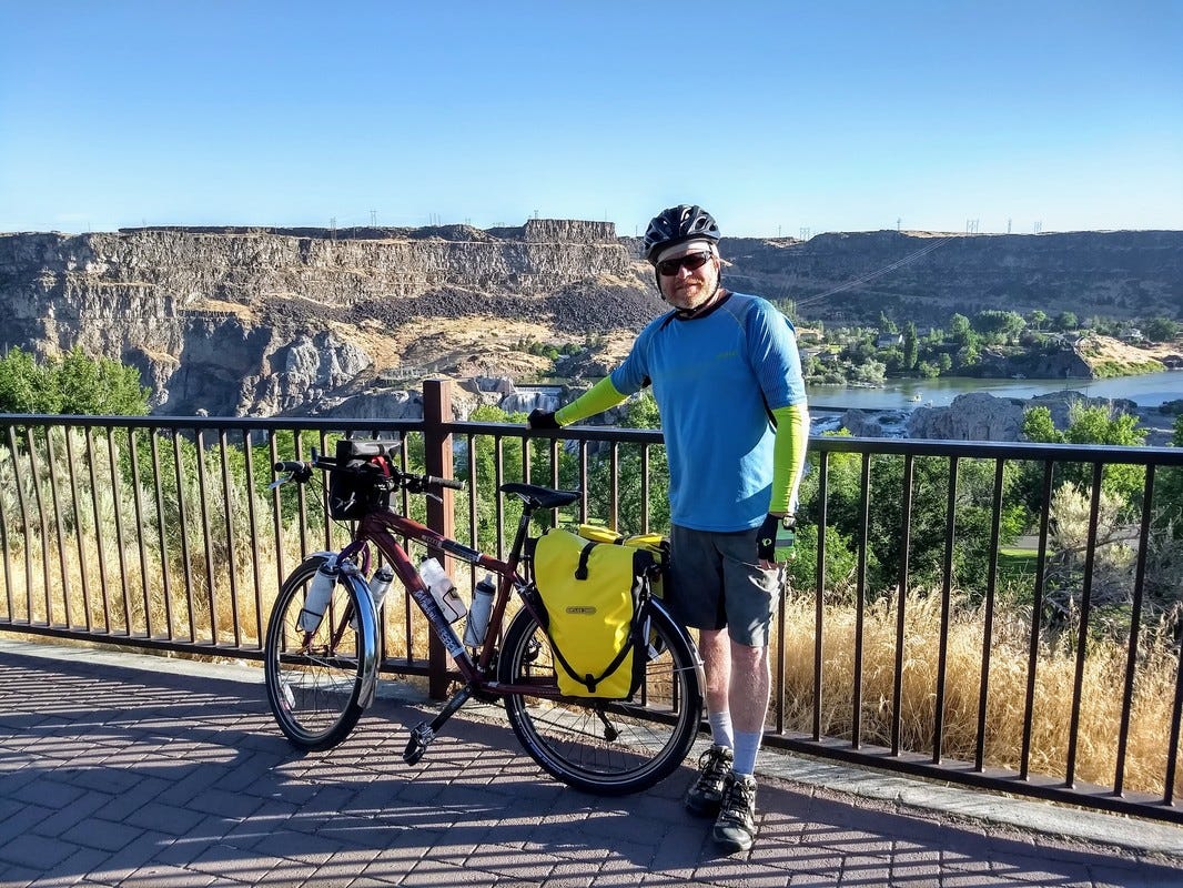 Dan Ekenberg poses with his e-bike near the Boise river.
