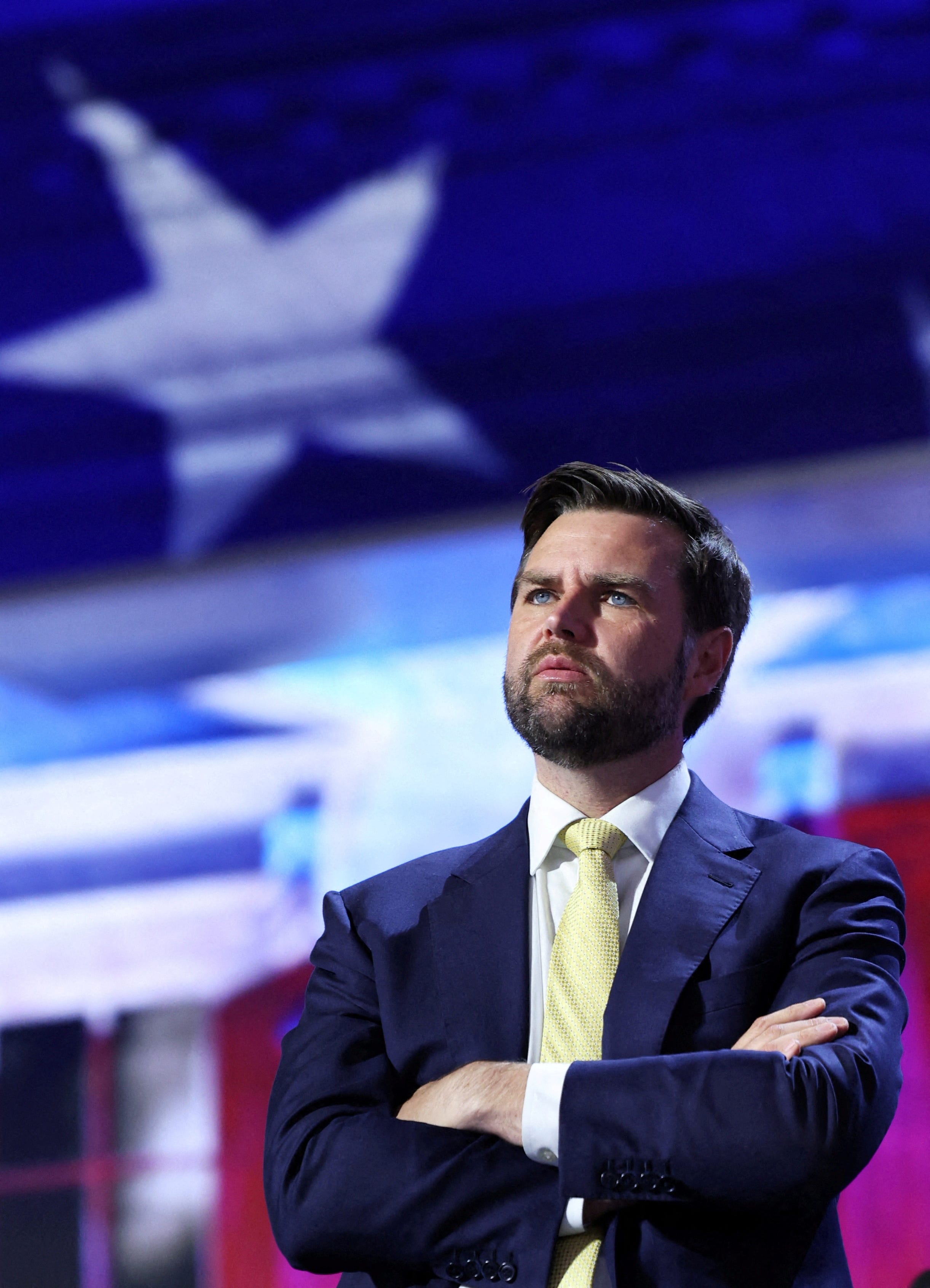 Republican vice-presidential nominee JD Vance stands onstage during his walk-thru ahead of Day 2 of the Republican National Convention (RNC), at the Fiserv Forum in Milwaukee, Wisconsin on July 16, 2024.