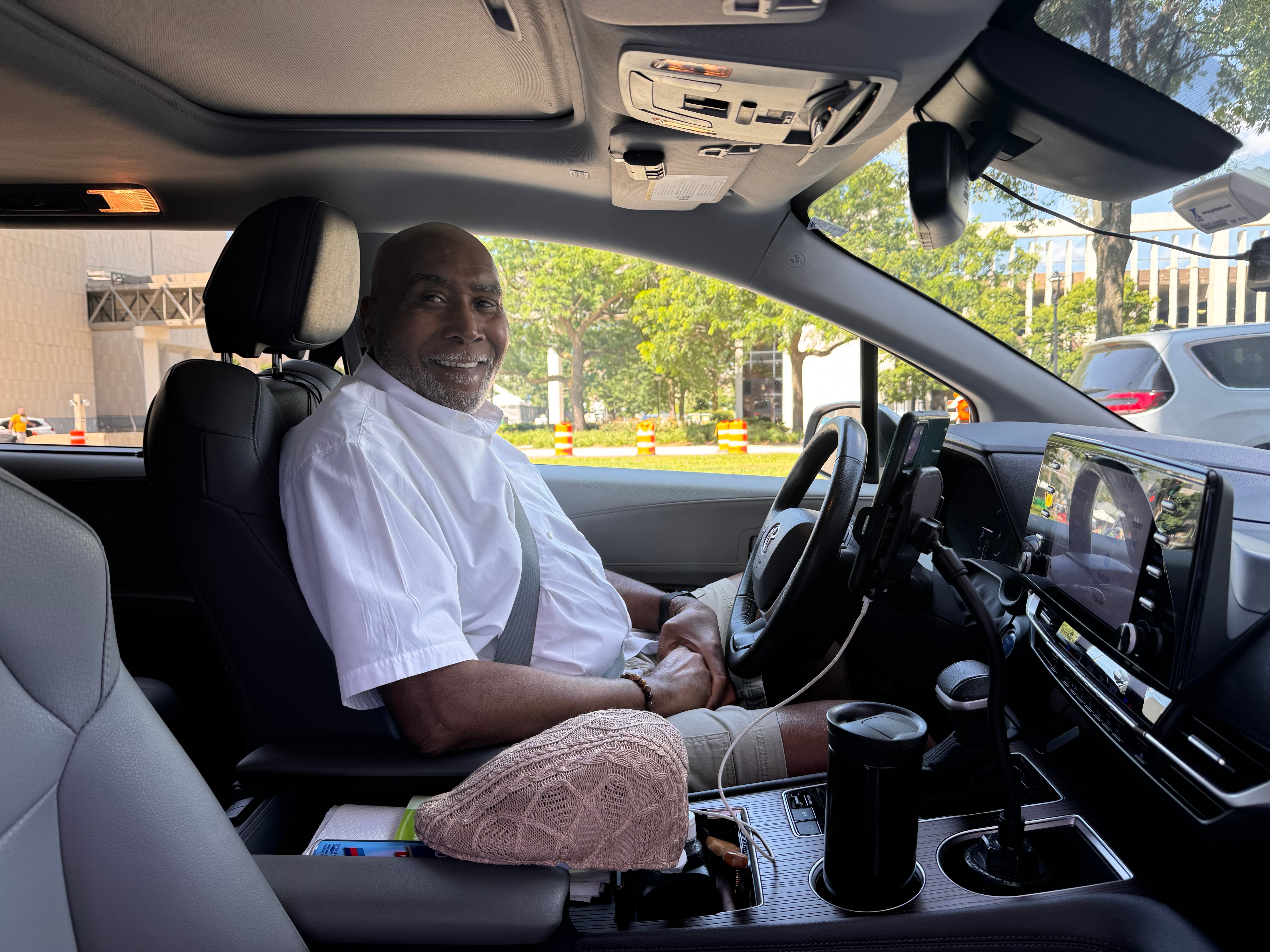 Curtis Boyd, a semi-retired Uber driver, sits in his Toyota Sienna in downtown Milwaukee on July 17, 2024. He said he's trying to avoid the streets around the Republican National Convention but the company's algorithm ultimately determine which rides he is offered.