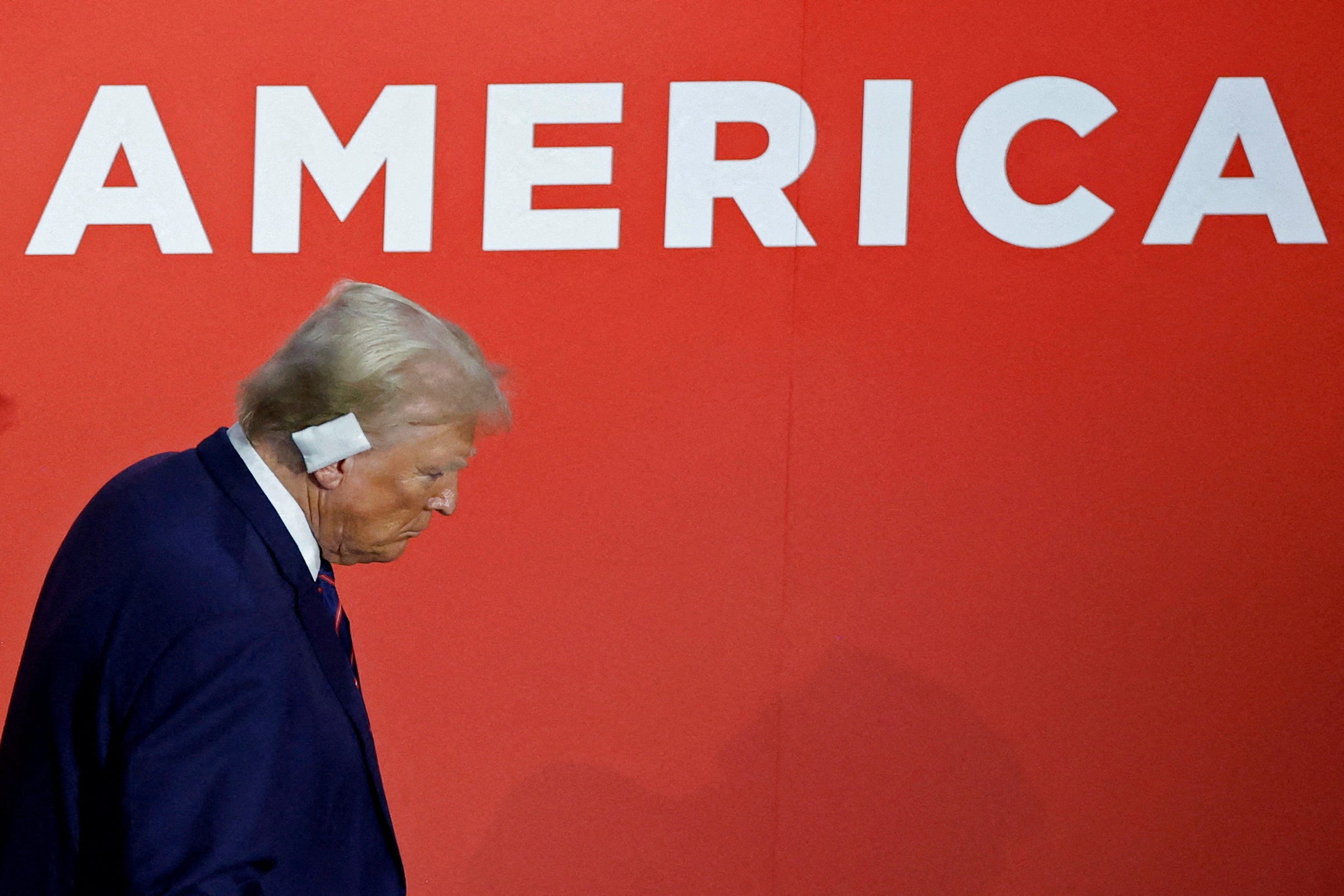 Republican presidential nominee and former U.S. President Donald Trump climbs down the stairs on Day 3 of the Republican National Convention (RNC), at the Fiserv Forum in Milwaukee, Wisconsin, U.S., July 17, 2024.