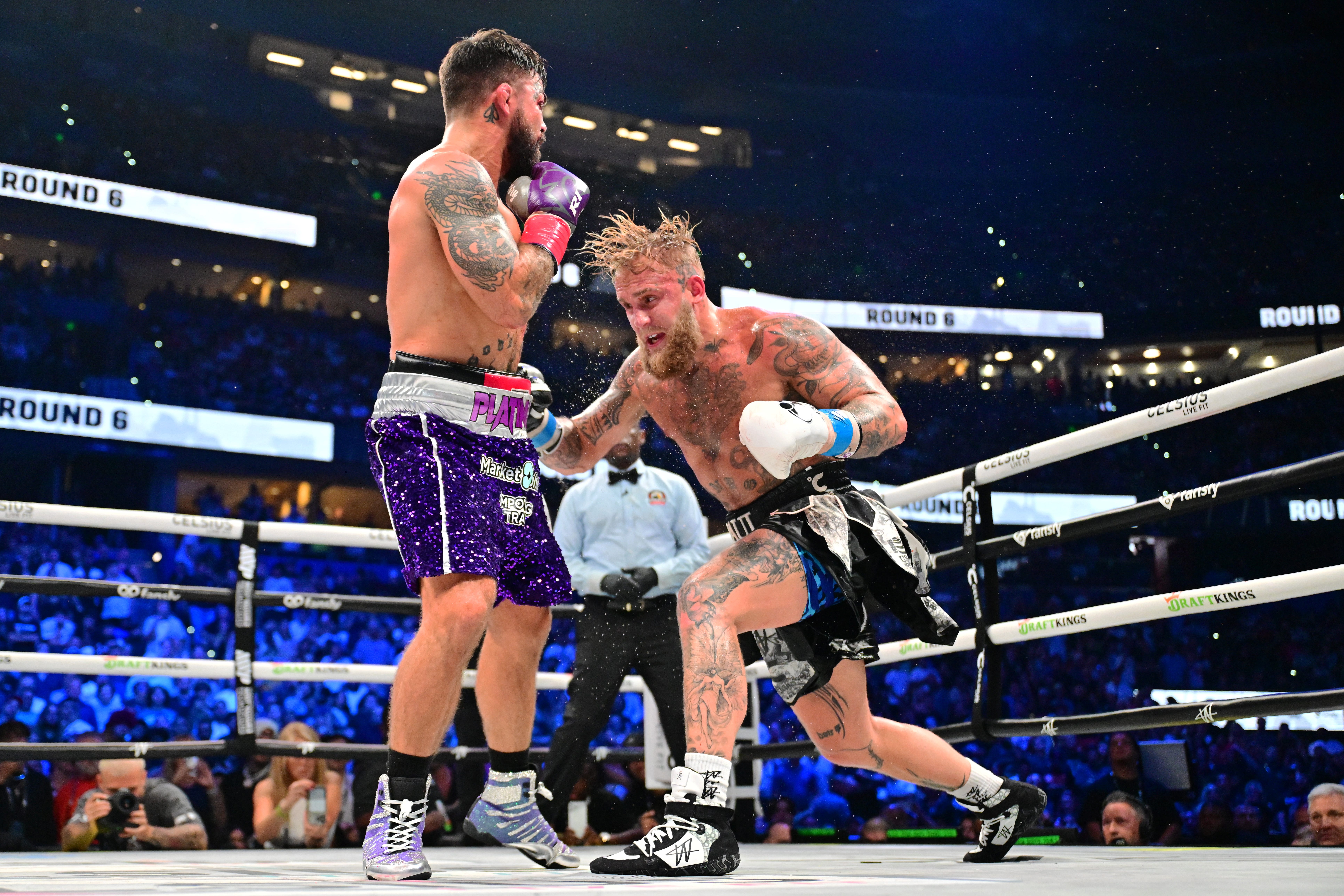 TAMPA, FLORIDA - JULY 20: Jake Paul punches Mike Perry during their cruiserweight fight at Amalie Arena on July 20, 2024 in Tampa, Florida. (Photo by Julio Aguilar/Getty Images)