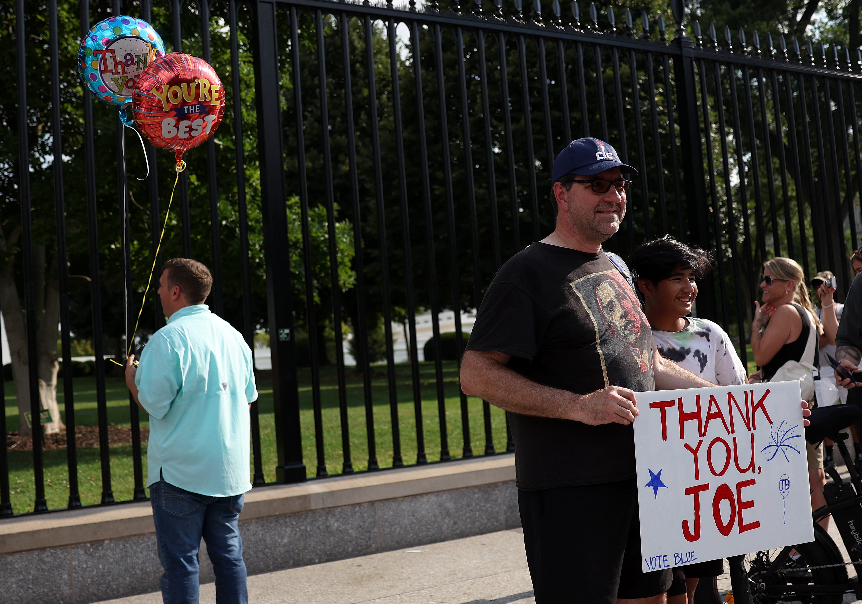 People stand outside the White House to show their appreciation for President Joe Biden after he announced his withdrawal from the presidential race on July 21, 2024.