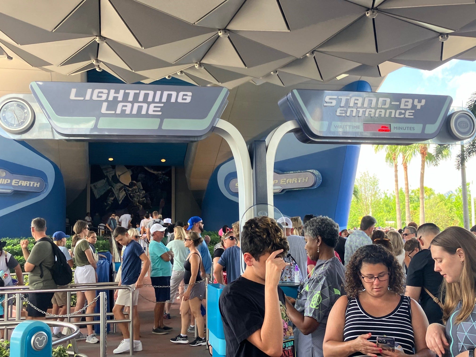 Guests queue up at Spaceship Earth at Epcot on the first day for Walt Disney World's new Lightning Lane system, which includes Multi Pass and Single Pass options for rides and attractions across WDW's four parks.