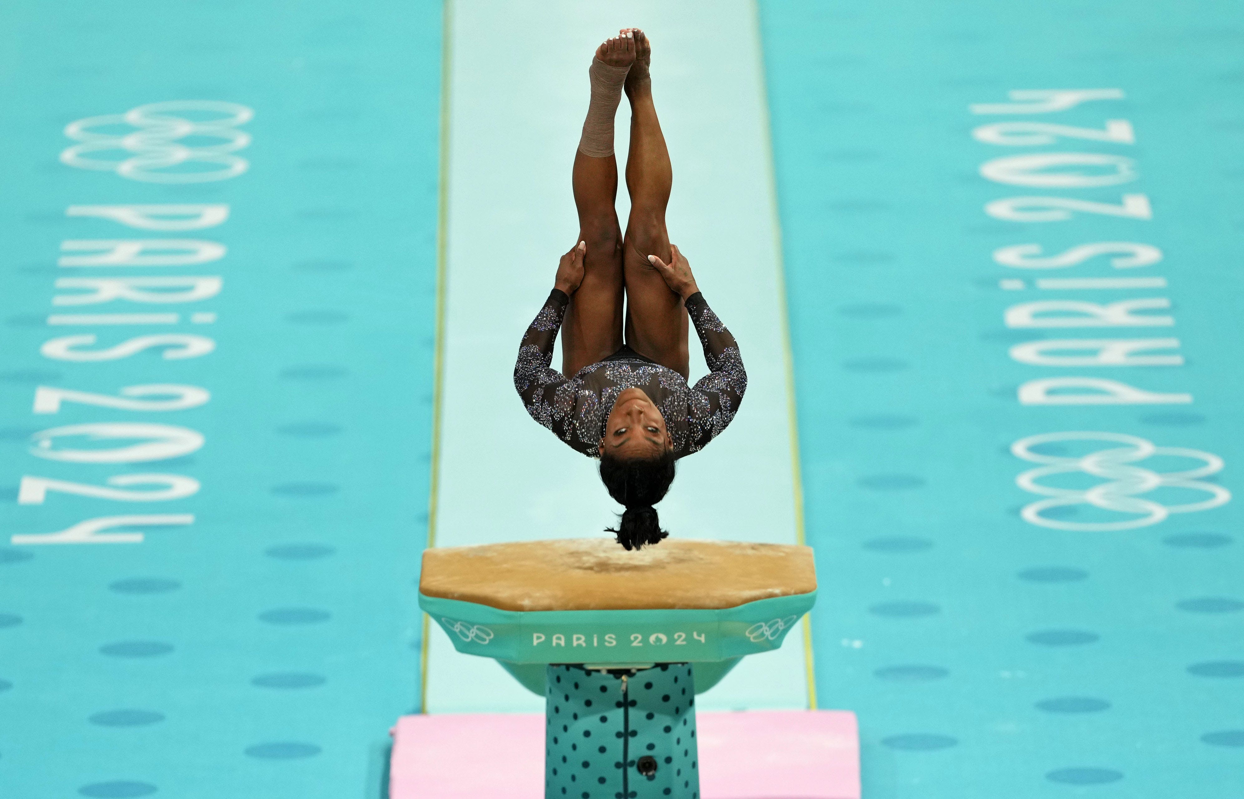 Jul 28, 2024; Paris, France; Simone Biles of the United States performs on the vault in women's qualification during the Paris 2024 Olympic Summer Games at Bercy Arena. Mandatory Credit: James Lang-USA TODAY Sports