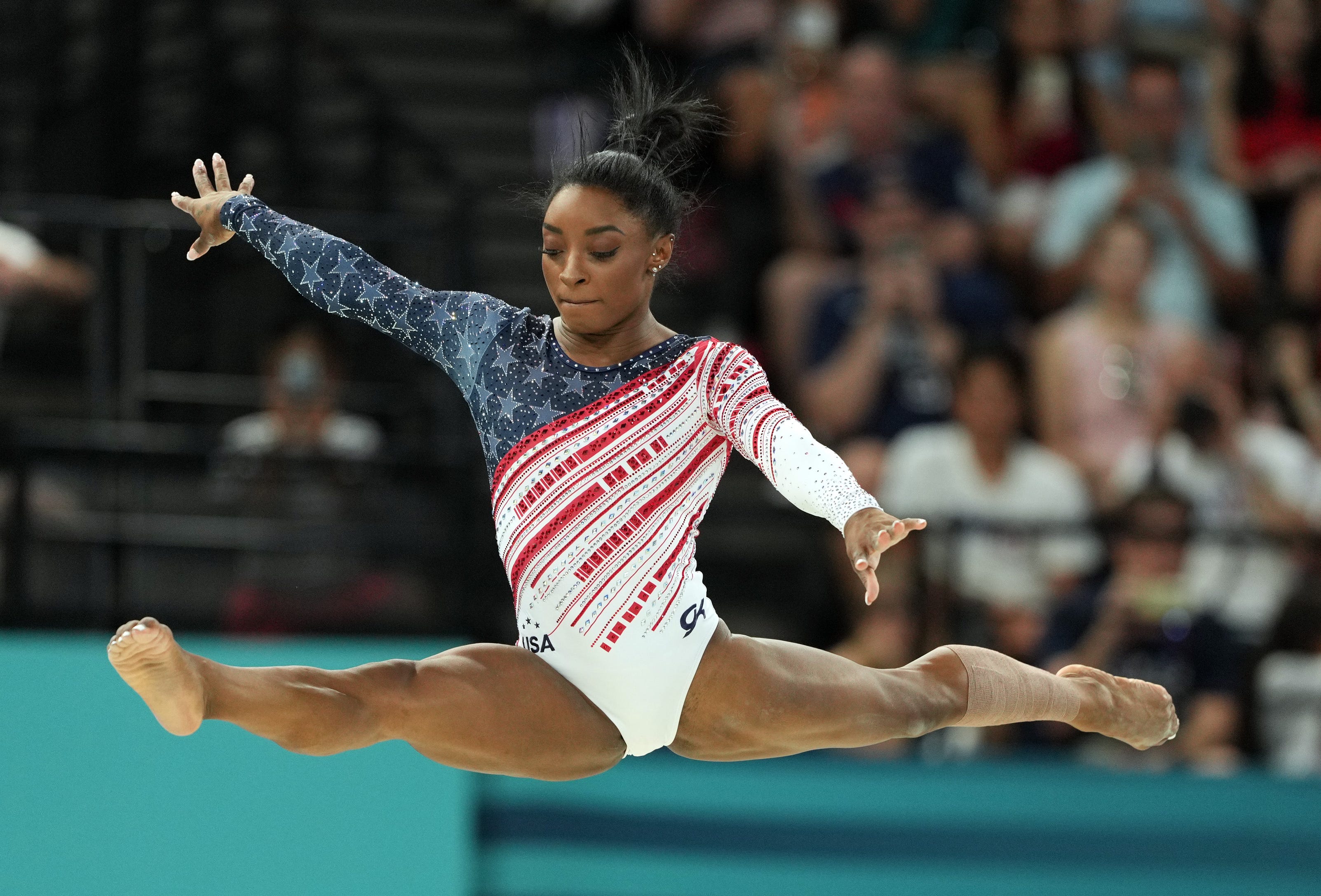 Simone Biles of the United States competes on the balance beam during the women's team final at the Paris 2024 Olympic Summer Games at Bercy Arena.
