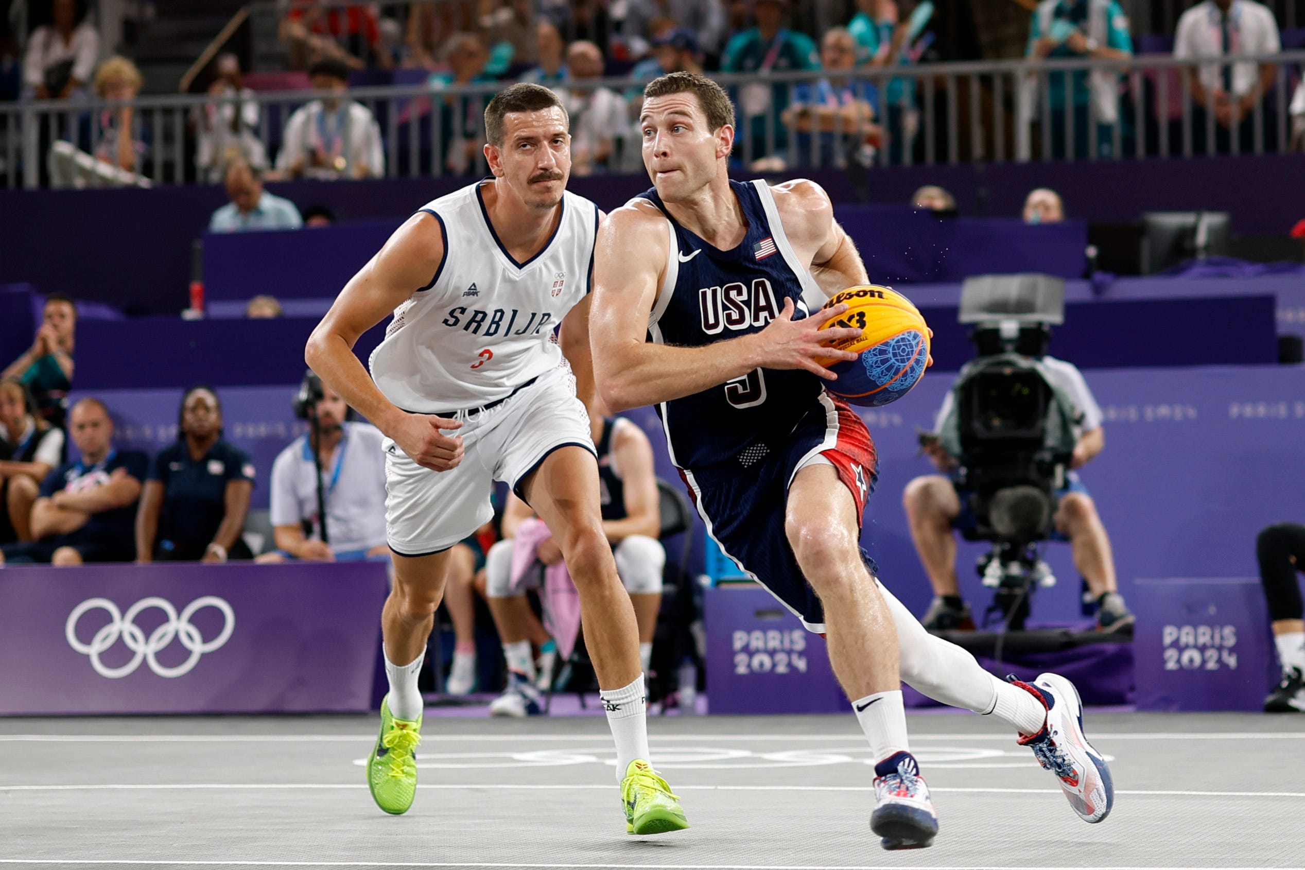 Jimmer Fredette controls the ball against Strahinja Stojacic in Team USA's loss to Serbia.