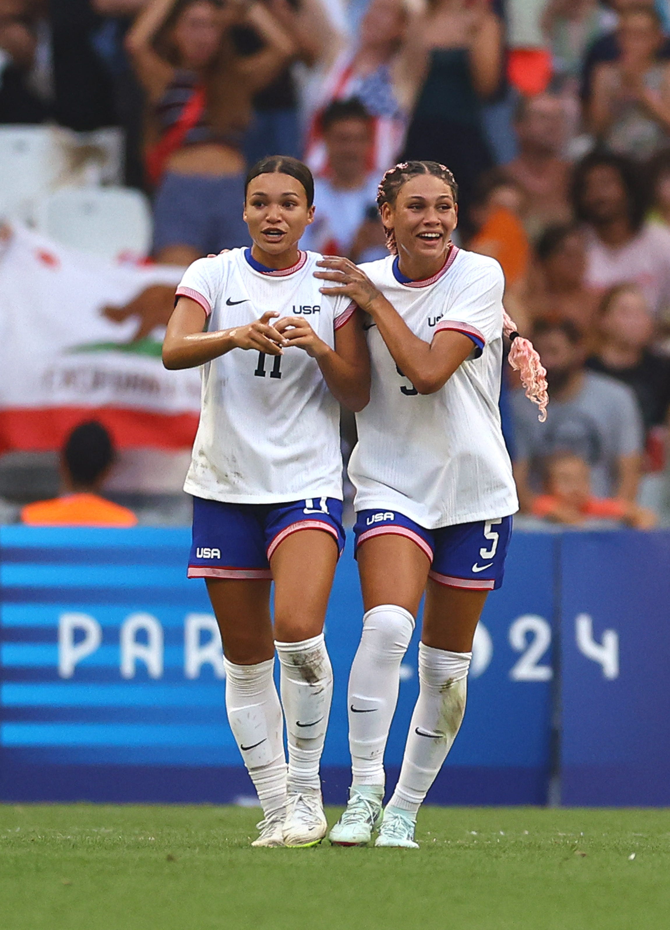 Trinity Rodman of United States celebrates with Sophia Smith after a goal against Australia in a group stage match during the Paris 2024 Olympic Summer Games at Orange Velodrome. Mandatory Credit: Luisa Gonzalez, USA TODAY Sports