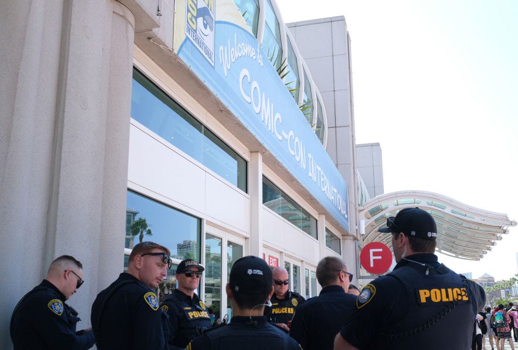 Police officers stand outside the San Diego Convention Center on the first day of Comic-Con International in San Diego, California, on July 24, 2024.