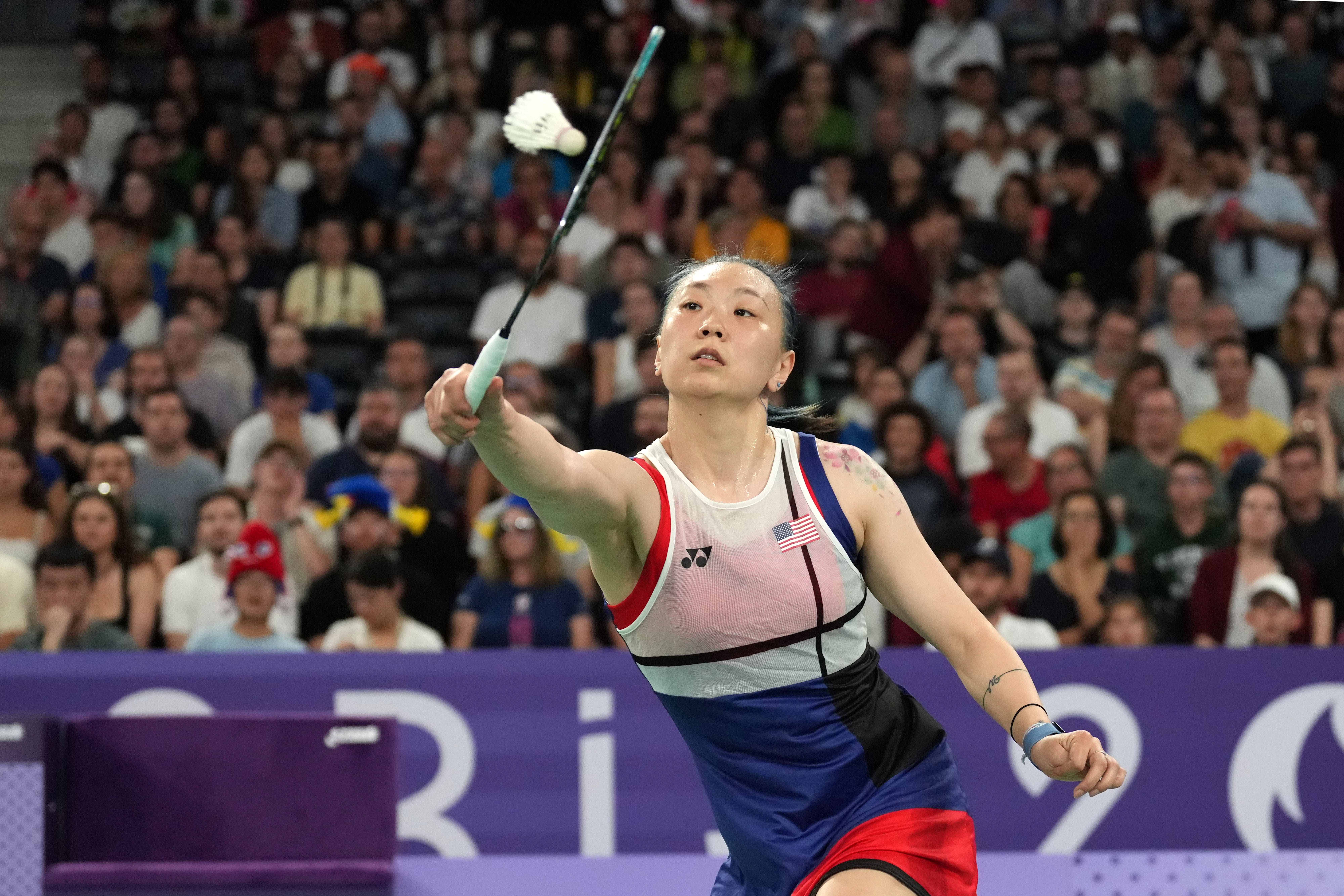 Beiwen Zhang plays Tiffany Ho of Australia in a women's singles match during the 2024 Paris Olympics.