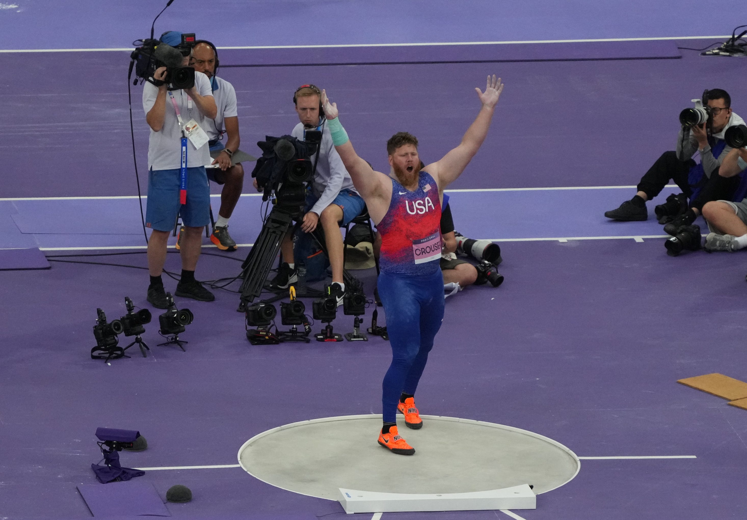 Ryan Crouser celebrates during Saturday's shot put final.