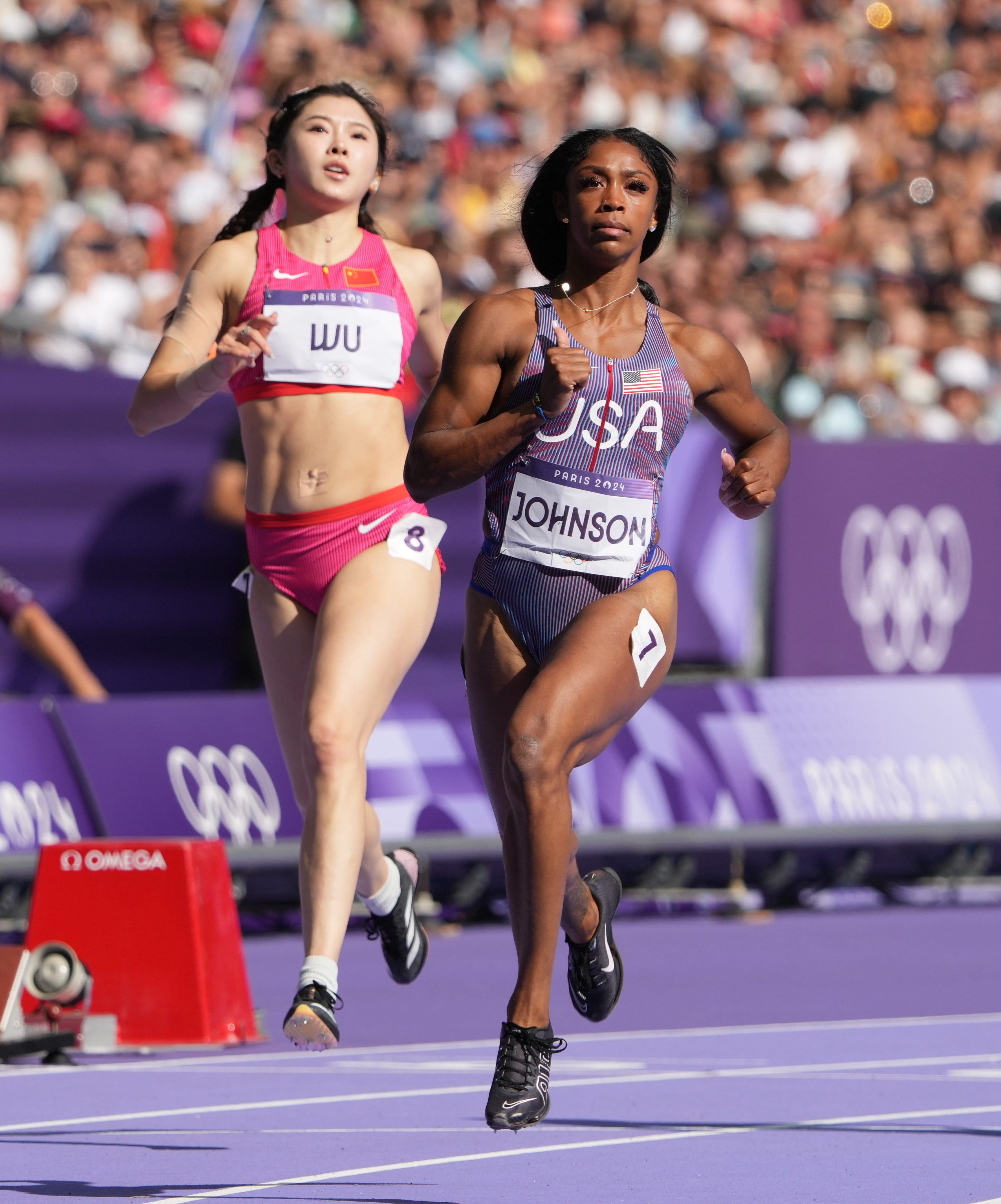 Alaysha Johnson (USA) races in the women's 100m hurdles heats.