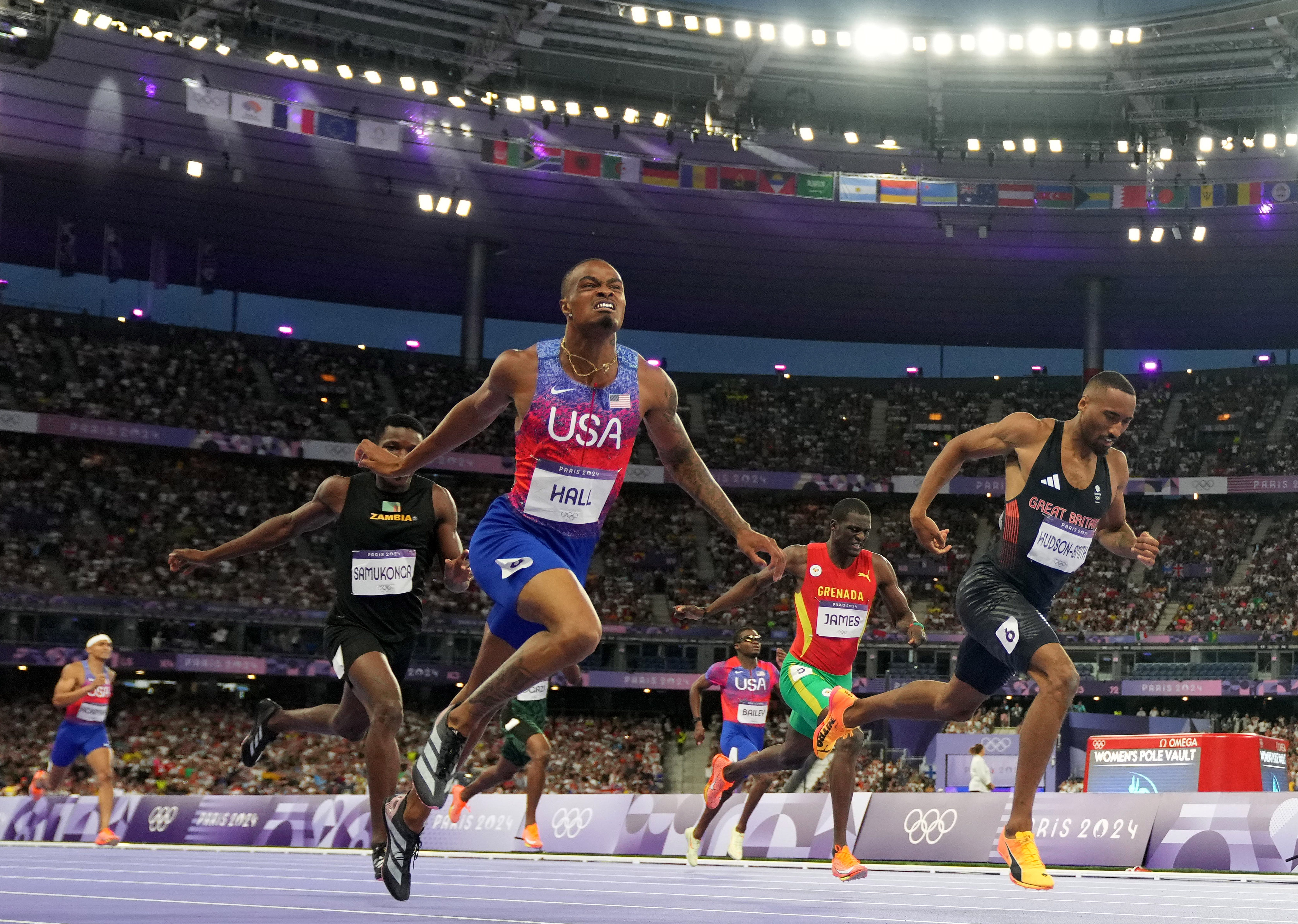 Quincy Hall of the United States crosses the finish line to win gold in the men's 400m final during the Paris 2024 Olympic Summer Games at Stade de France.