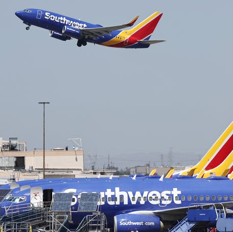 BURBANK, CALIFORNIA - JULY 25: A Southwest Airlines plane takes off from Hollywood Burbank Airport as other Southwest planes are parked at their gates on July 25, 2024 in Burbank, California. Southwest Airlines has announced it will discontinue its 50-year policy of open seating, instead opting for assigned seating that will include premium seating in an effort to broaden its appeal.