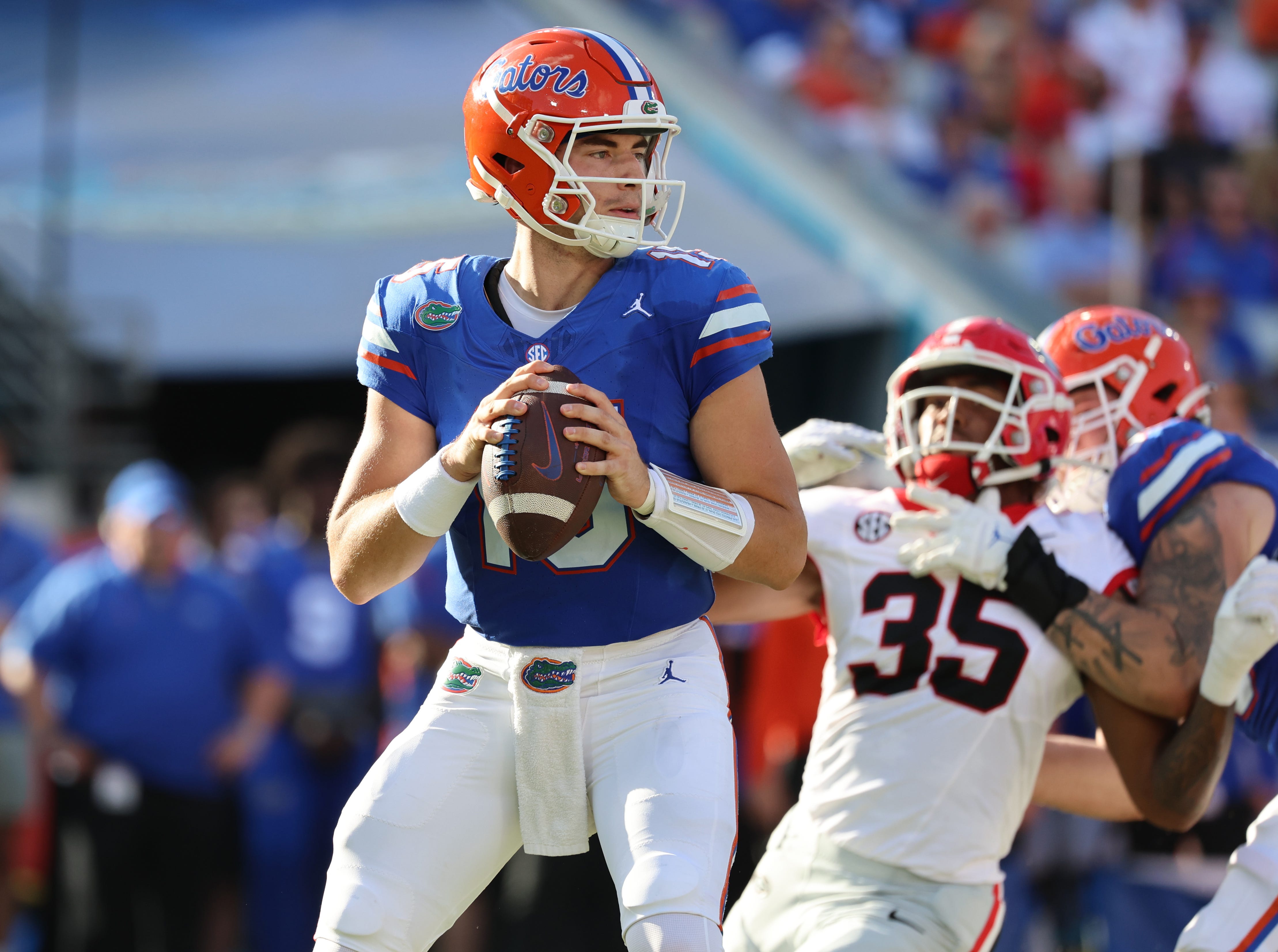 Florida quarterback Graham Mertz (15) drops back against the Georgia during the first half of their 2023 game at EverBank Stadium.