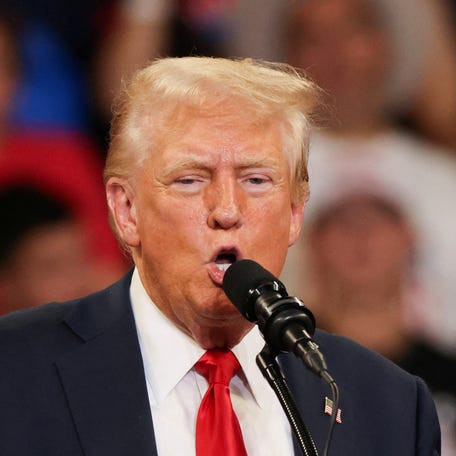 FILE PHOTO: Republican presidential nominee and former U.S. President Donald Trump speaks during a campaign rally held with Republican vice presidential nominee Senator JD Vance, in Atlanta, Georgia, U.S., August 3, 2024. REUTERS/Umit Bektas/File Photo