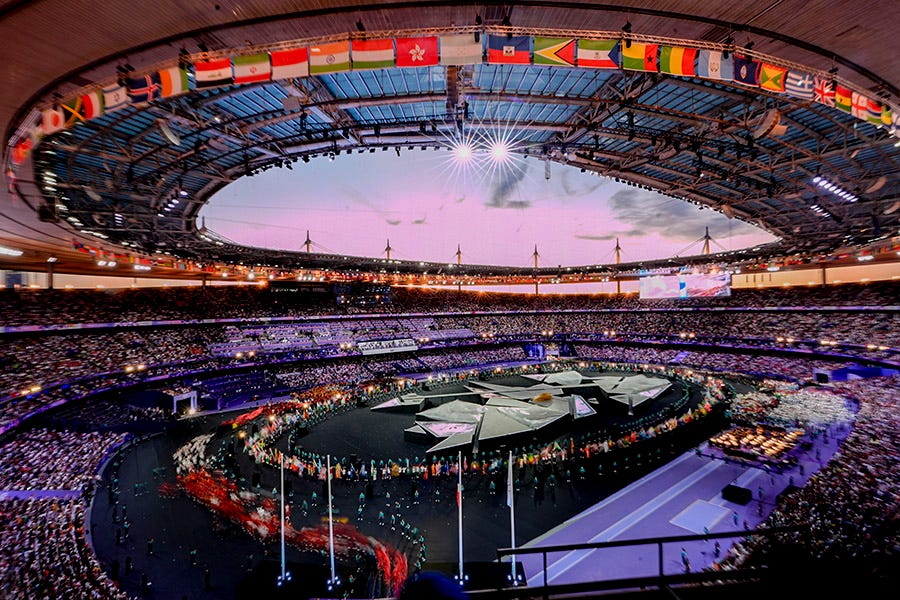 Athletes file into the arena during the closing ceremony for the Paris 2024 Olympic Summer Games at Stade de France.