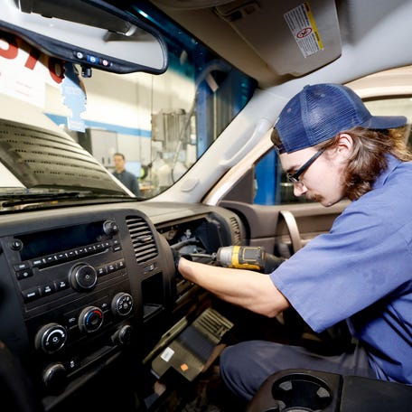 Bowman Chevrolet service technician Anthony Carbone, 22, of Rochester Hills, takes out a recalled Takata front passenger airbag out of a Chevrolet Silverado and he prepares to replace it with another one in Clarkston on Tuesday, June 25, 2024