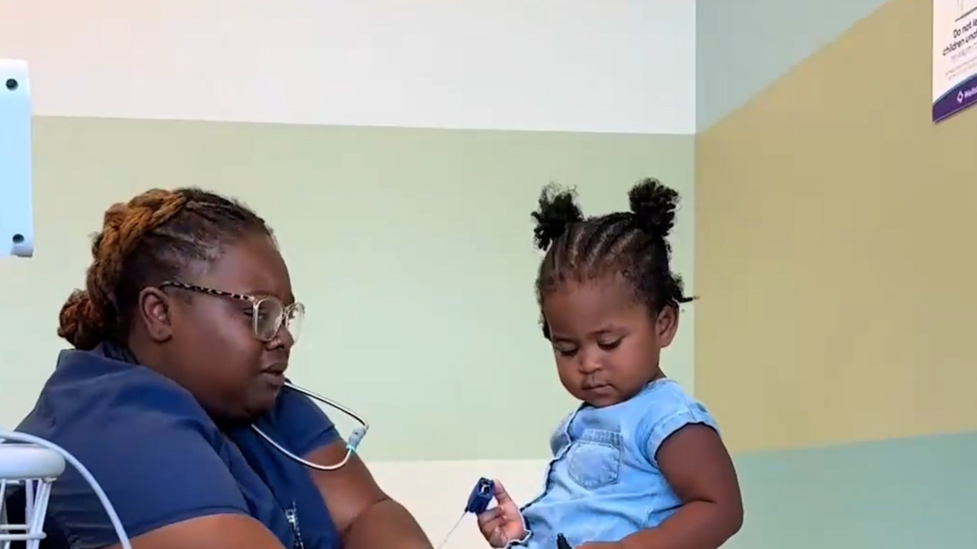 Nurse Casey has a wholesome interaction with her toddler patient who answers questions as well as explains procedures in Marietta, Georgia.