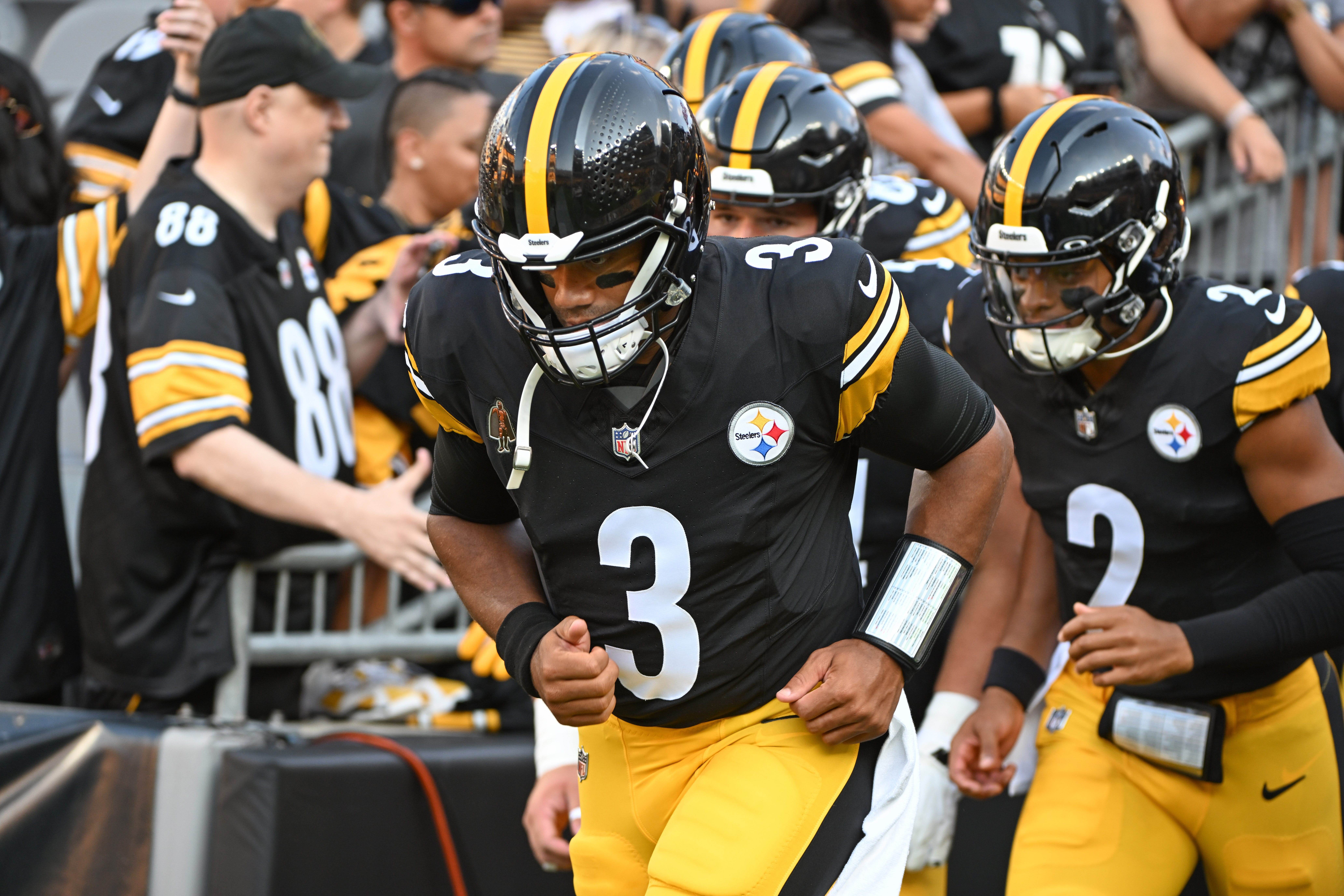Aug 9, 2024; Pittsburgh, Pennsylvania, USA; Pittsburgh Steelers quarterback Russell Wilson (3) and Justin Fields (2) take the field for pre-game against the Houston Texans at Acrisure Stadium. Mandatory Credit: Barry Reeger-USA TODAY Sports ORG XMIT: IMAGN-880838 ORIG FILE ID: 20240809_tbs_ii9_001.JPG
