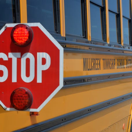 A Millcreek Township School District bus is shown after school on May 25, 2023. New camera technology purchased by MTSD officials will likely improve safety by sending citations to drivers who pass when buses are stopped, with stop signs lit and extended.