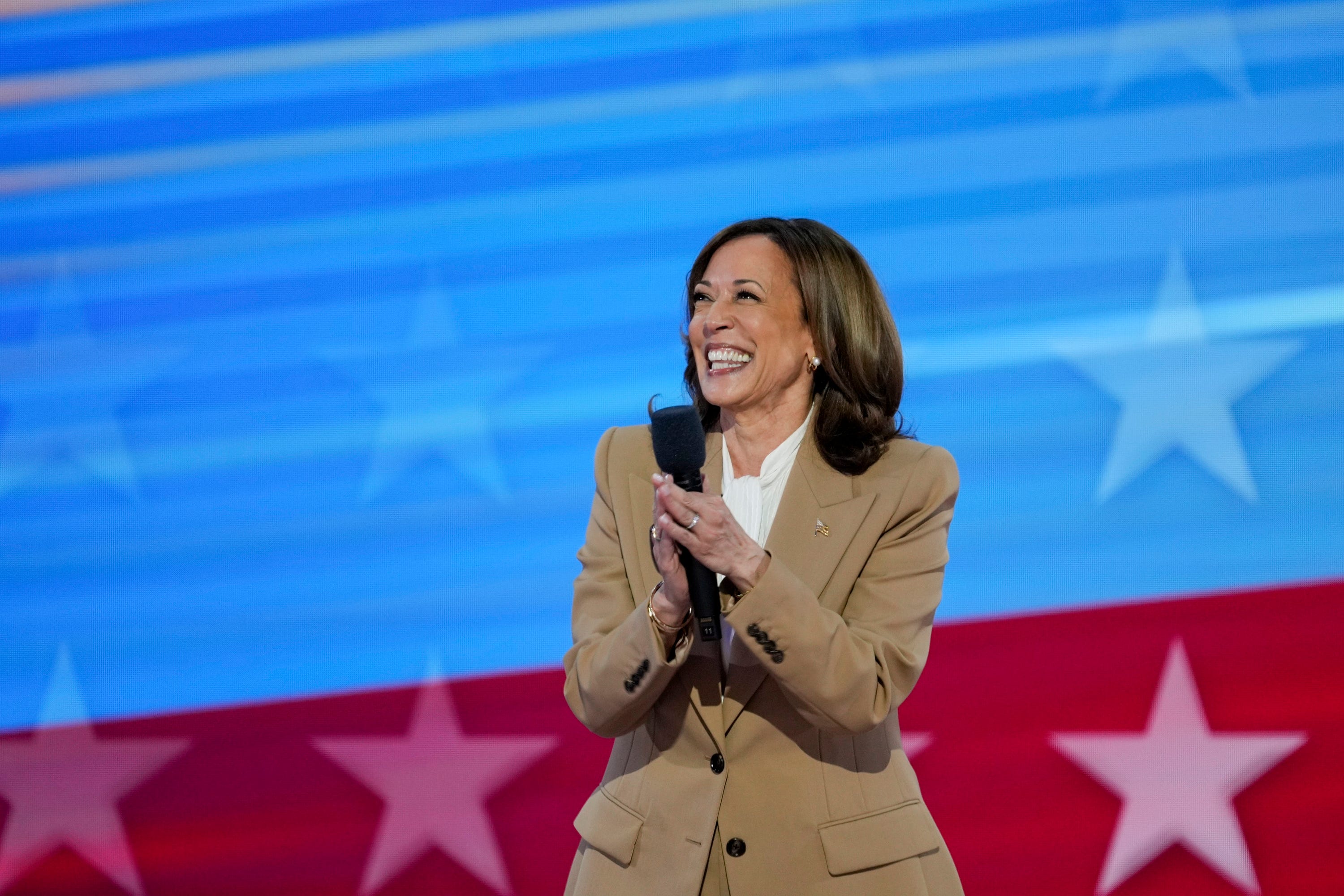 Vice President Kamala Harris takes the stage during the first day of the Democratic National Convention at the United Center. The DNC program will feature President Joe Biden and Former Secretary of State Hillary Clinton during Monday's ceremonies.