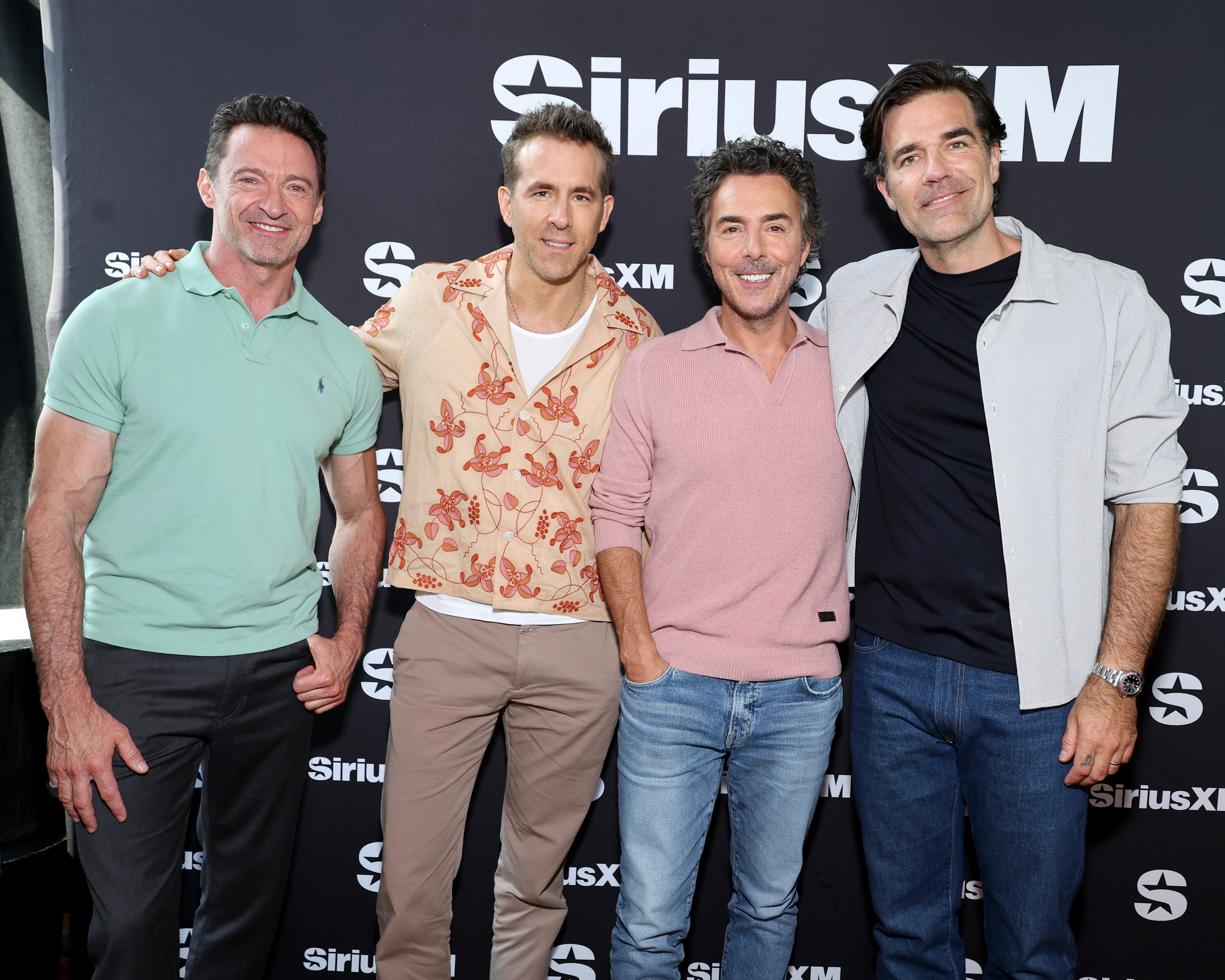 From left, Hugh Jackman, Ryan Reynolds, director Shawn Levy and Rob Delaney promote "Deadpool & Wolverine" on SiriusXM on July 19, 2024, in New York City.