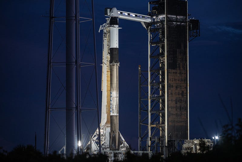 The Falcon 9 rocket with the SpaceX Dragon capsule perched atop it are photographed at the Kennedy Space Center in Florida as launch preparations for Tuesday were underway.