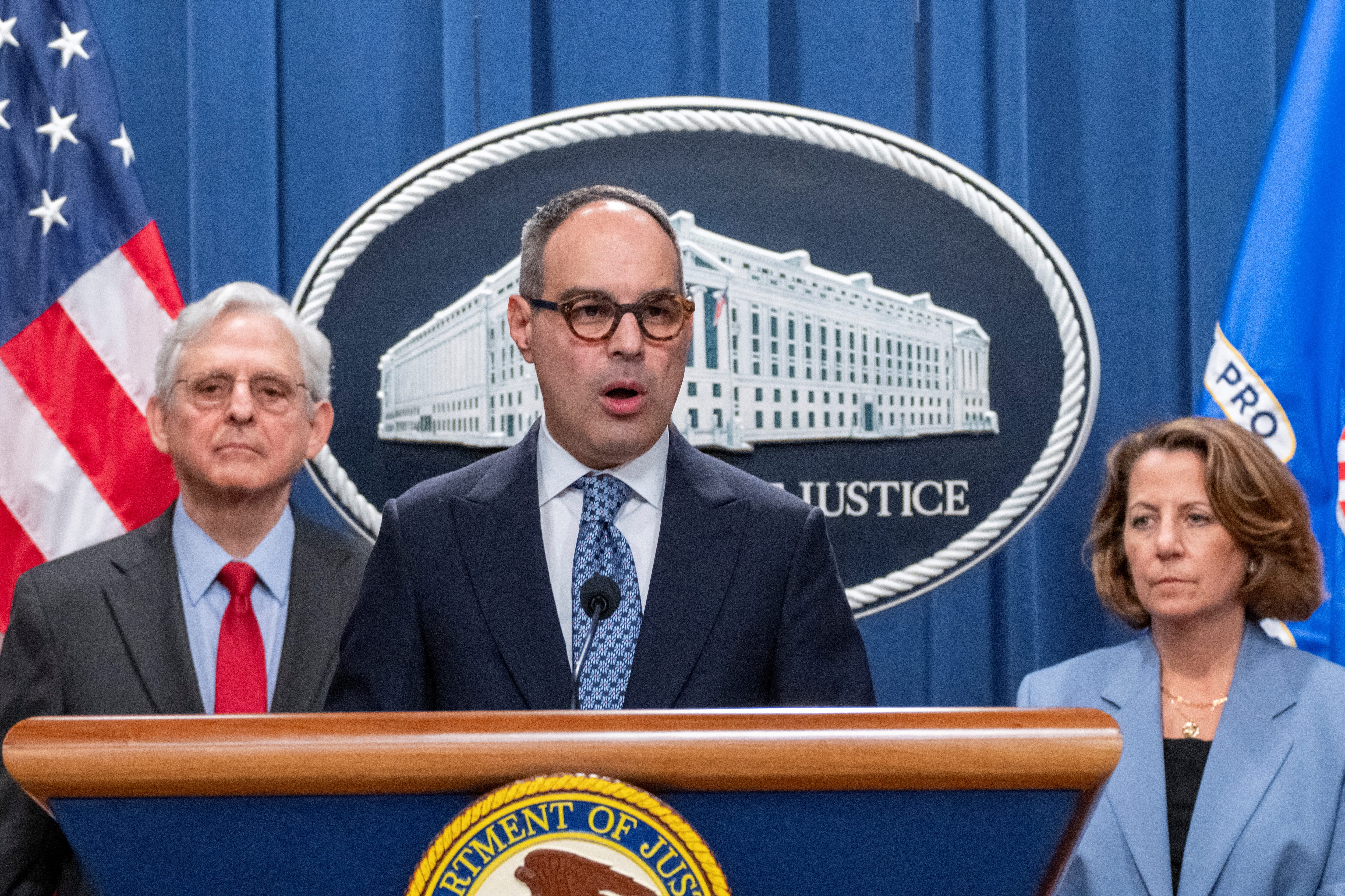 Assistant Attorney General Jonathan Kanter speaks about the antitrust lawsuit against Live Nation Entertainment during a press conference as Attorney General Merrick Garland and Deputy Attorney General Lisa Monaco look on during a press conference at the Department of Justice in Washington, on May 23, 2024.