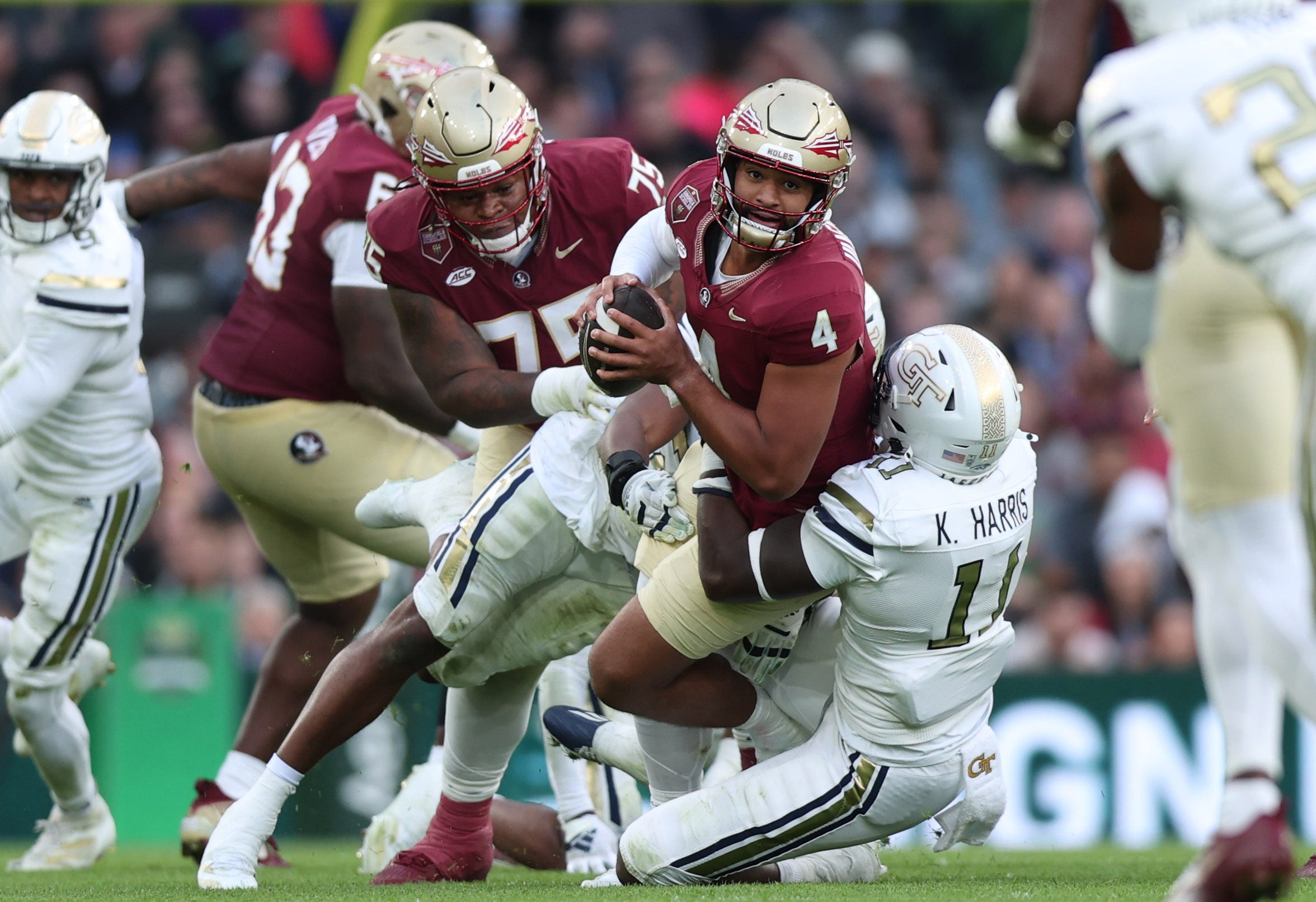 Georgia Tech defensive lineman Kevin Harris II tackles Florida State University quarterback DJ Uiagalelei at Aviva Stadium on Aug 24, 2024