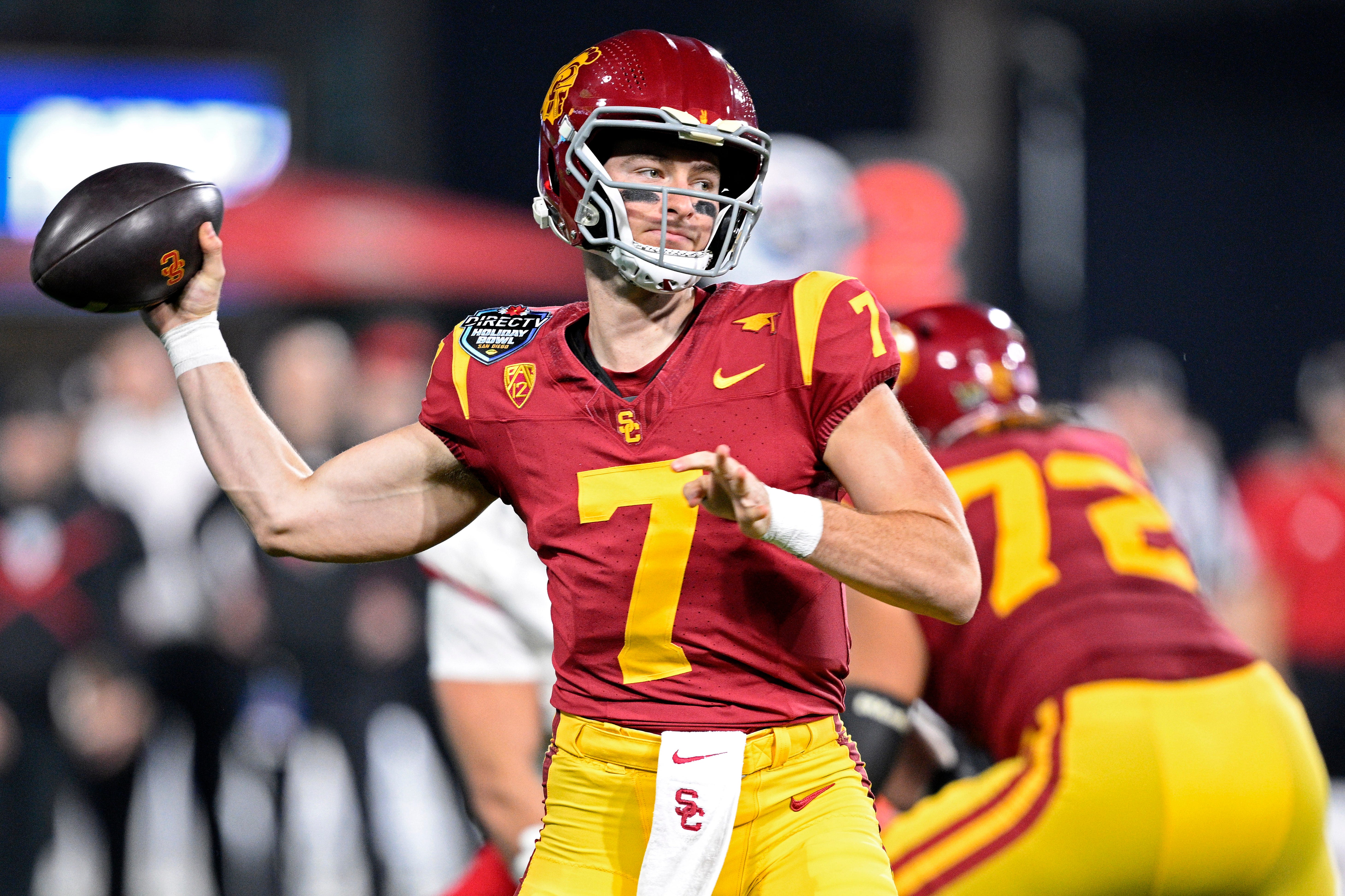 Southern California quarterback Miller Moss (7) throws a pass against Louisville during the first half of the 2023 Holiday Bowl at Petco Park.