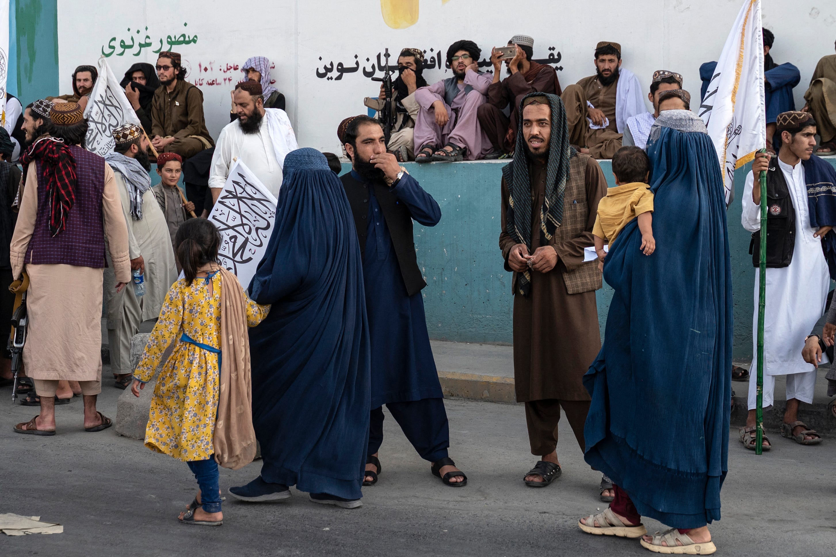 Burqa-clad women walk in Kabul, the capital of Afghanistan, on Aug. 14, 2024, three years after the U.S. military left the nation and the Taliban took over.
