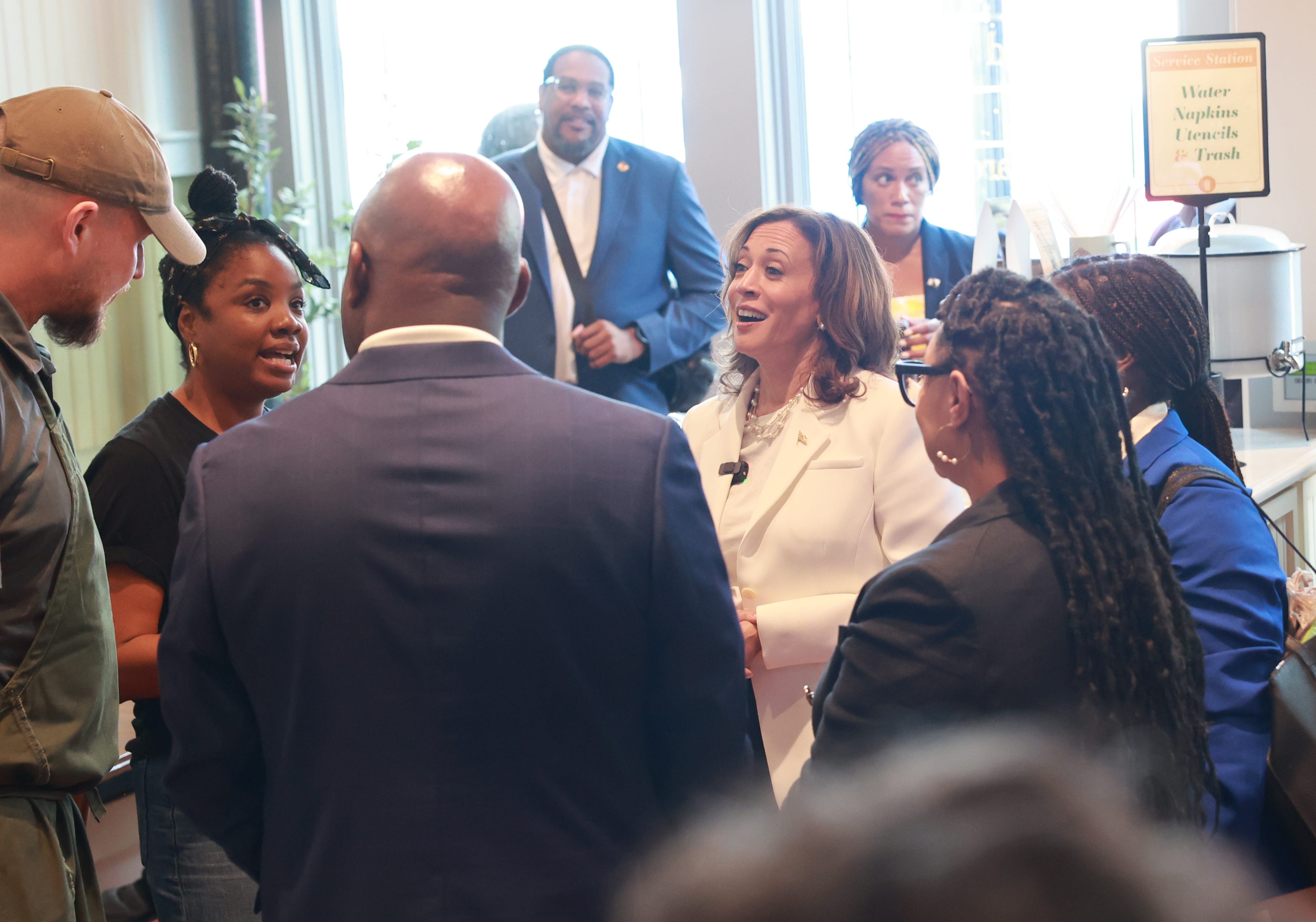 Thursday, August 29, 2024; Savannah, Georgia; Democratic Presidential nominee Vice President Kamala Harris talks with the owners of Dottie's Market during a campaign bus tour stop in Savannah, Georgia on Thursday, August 29, 2024.