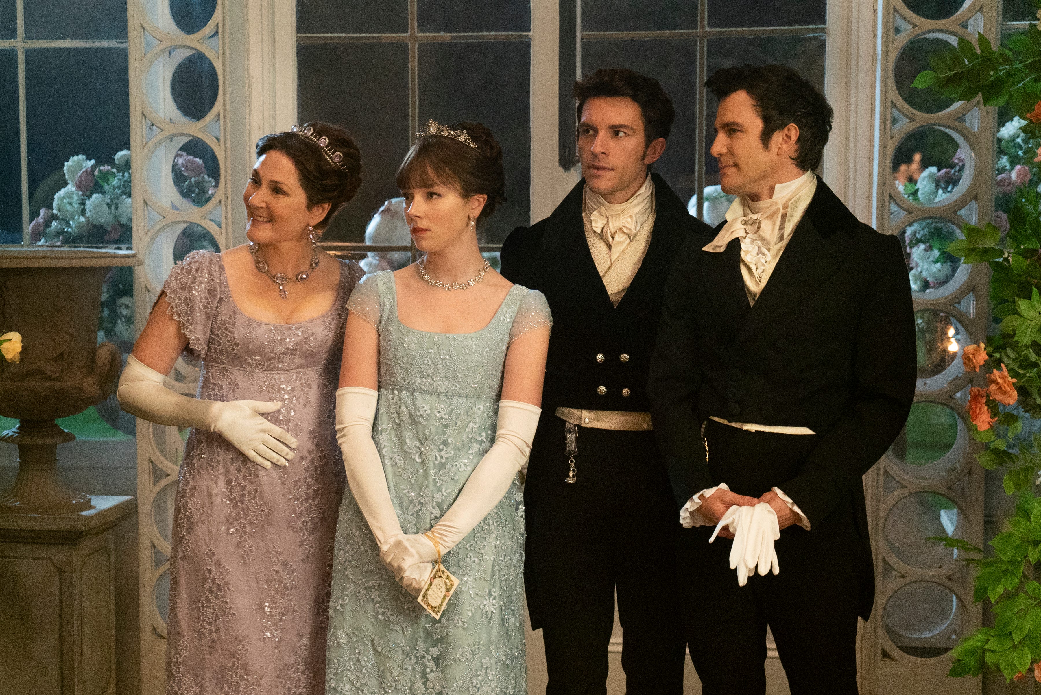 (L to R) Ruth Gemmell as Lady Violet Bridgerton, Claudia Jessie as Eloise Bridgerton, Jonathan Bailey as Anthony Bridgerton, and Luke Thomspon as Benedict Bridgerton in Season 2 of "Bridgerton."