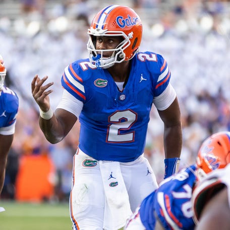Florida quarterback DJ Lagway (2) gestures before a play against Miami during their game at Ben Hill Griffin Stadium.