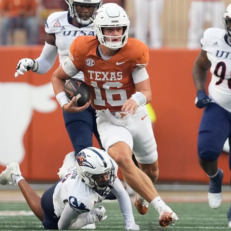 Texas quarterback Arch Manning (16) breaks away from defenders for a touchdown run during the first half against Texas-San Antonio at Darrell K Royal-Texas Memorial Stadium.
