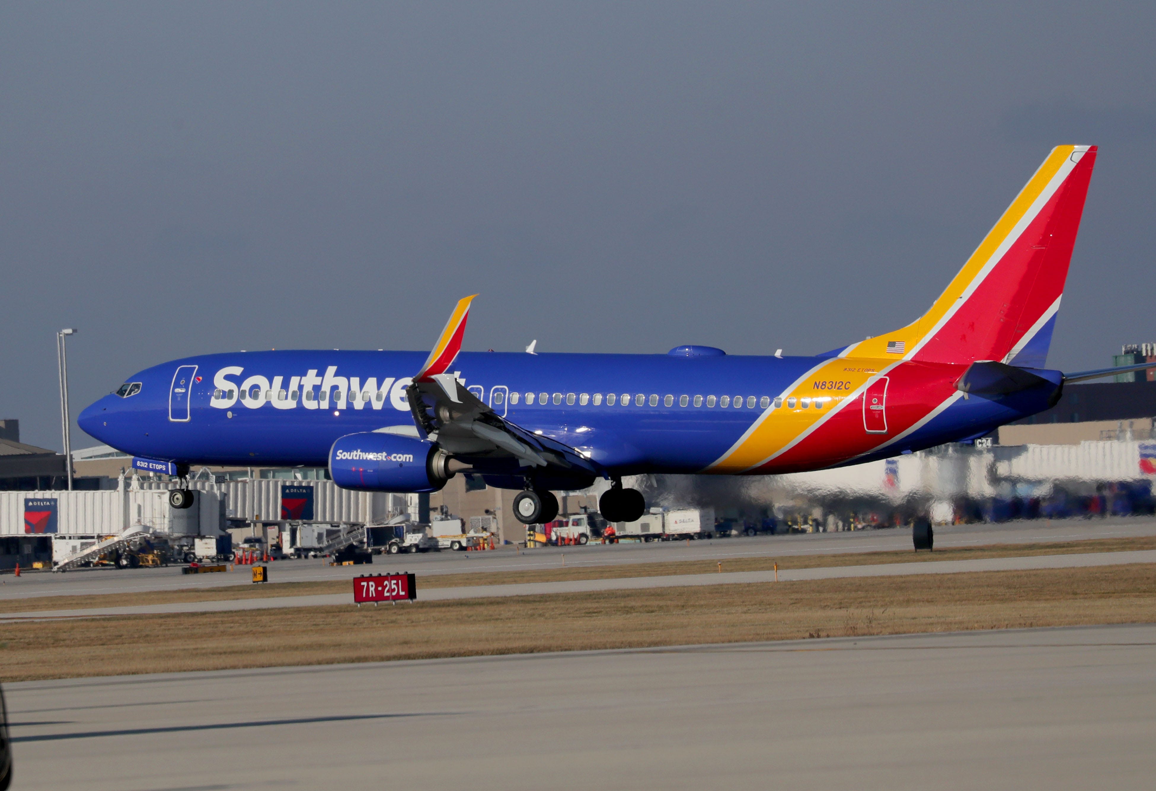 A Southwest Airlines plane takes off. The airline company reportedly plans to cut hundreds of pilot and flight attendant positions and reduce service to and from Atlanta early next year.