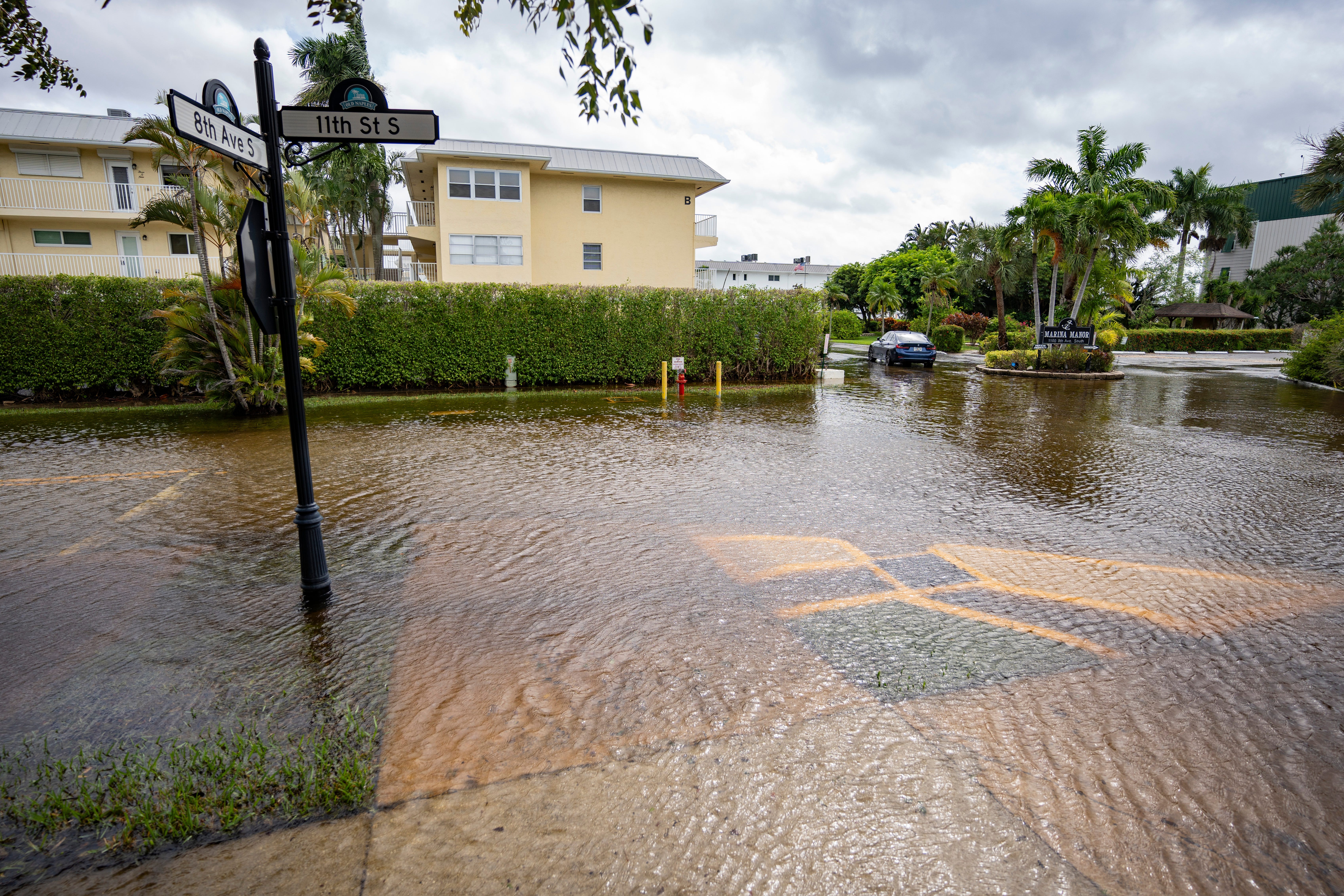 Water from Naples Bay floods the area at Eighth Avenue South and 11th Street South in Naples as Hurricane Helene passes off the coast on Thursday, Sept. 26, 2024.