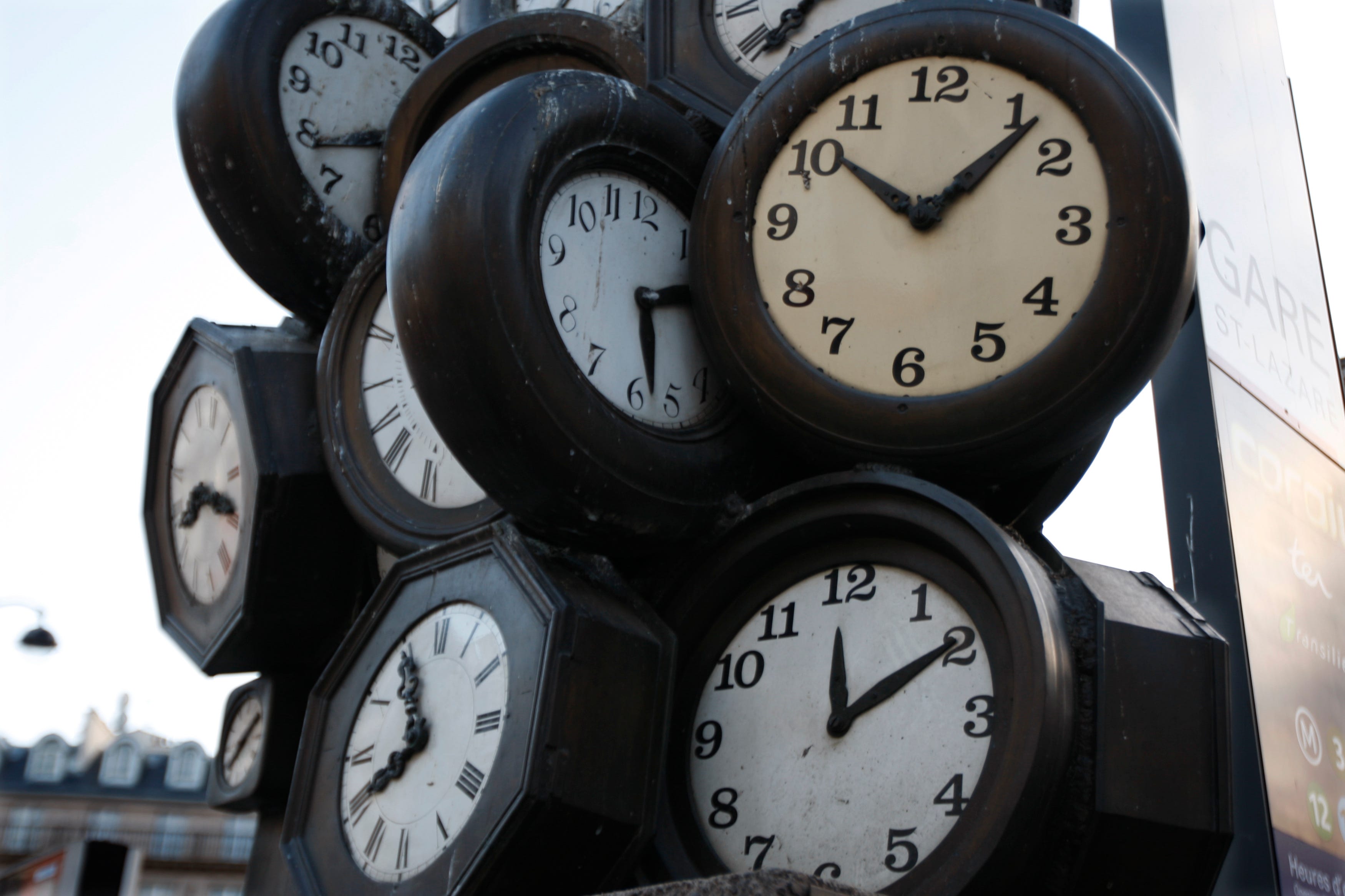 A giant sculpture constructed with the faces of clocks is seen outside a Paris train station, March 27, 2009.
