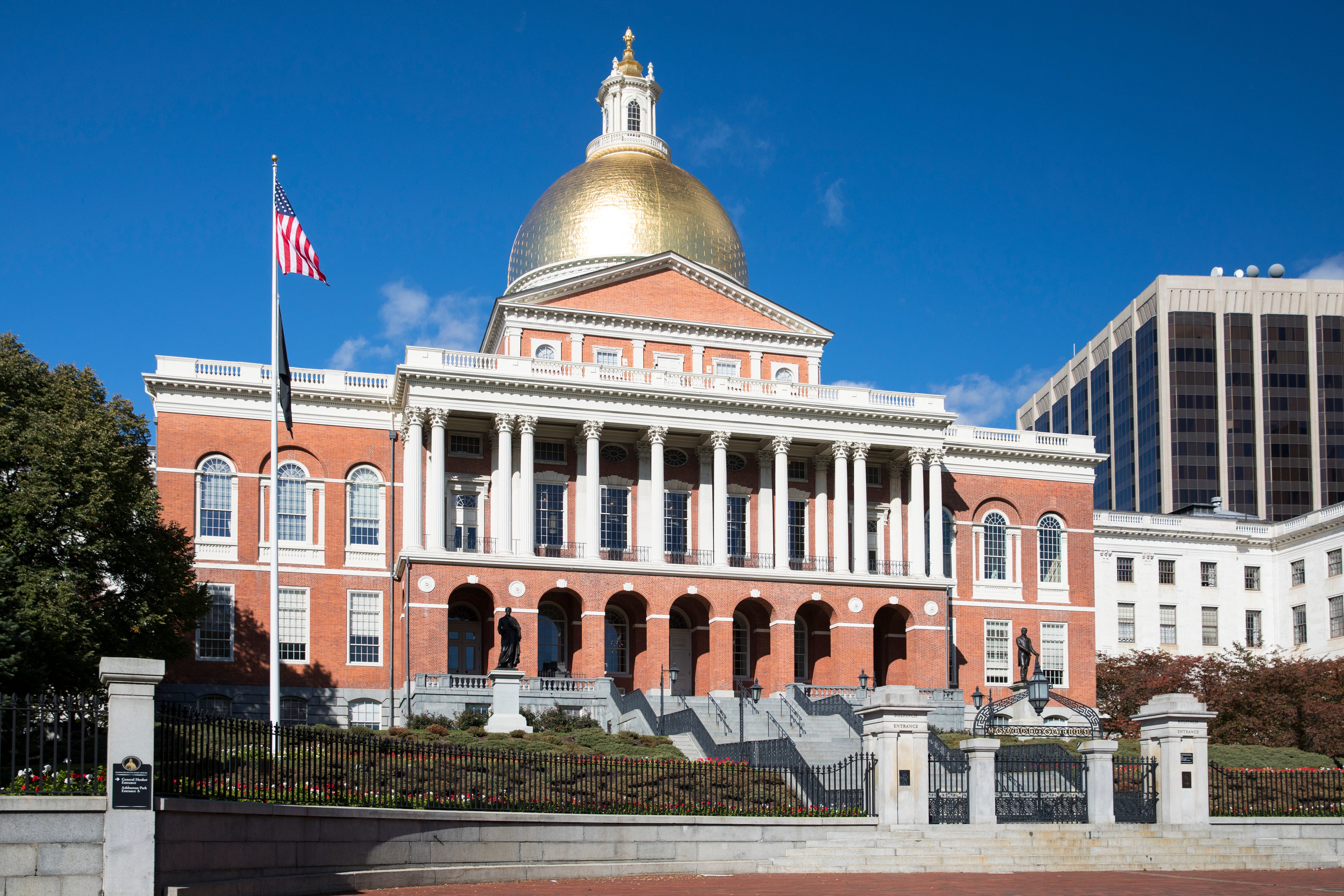 Massachusetts State House the seat of Government, with golden dome and patriotic Stars and Strips flag in the city of Boston, United States. (Photo by Tim Graham/Getty Images)