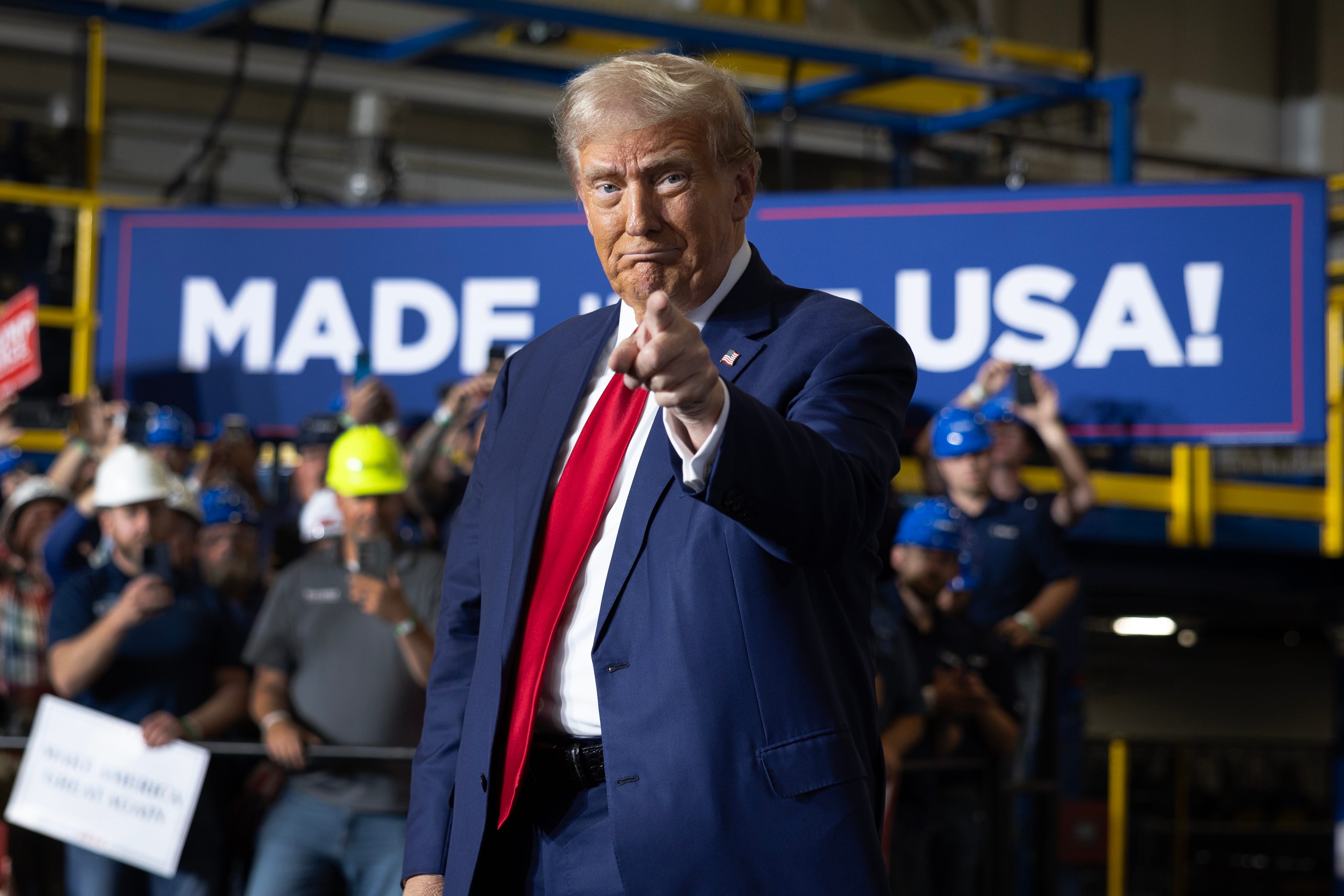 Former President Donald Trump campaigns for reelection at a manufacturing facility on Sept. 27, 2024, in Walker, Mich.